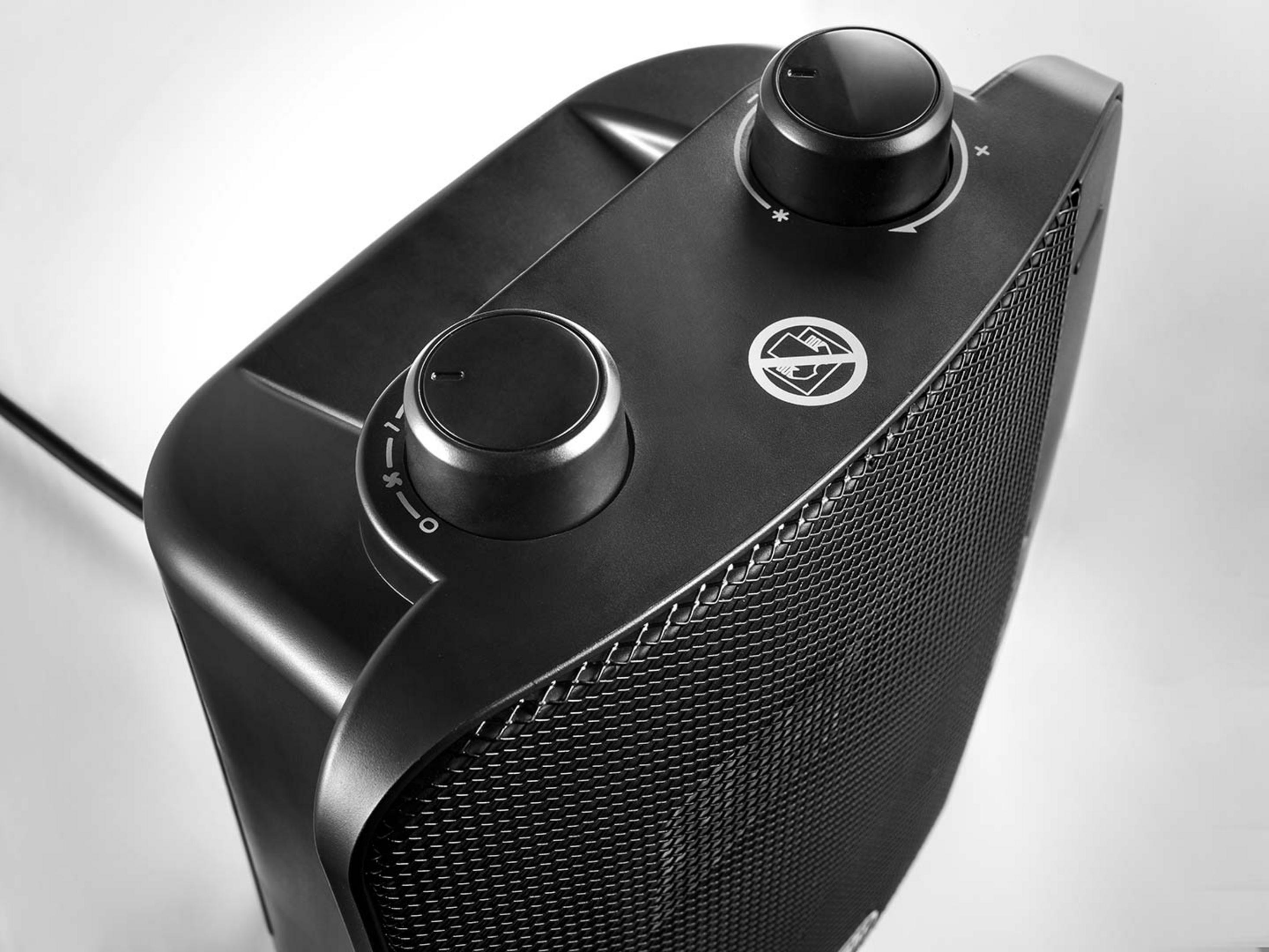 Czarna farelka z dwoma pokrętłami i symbolem ostrzegawczym.