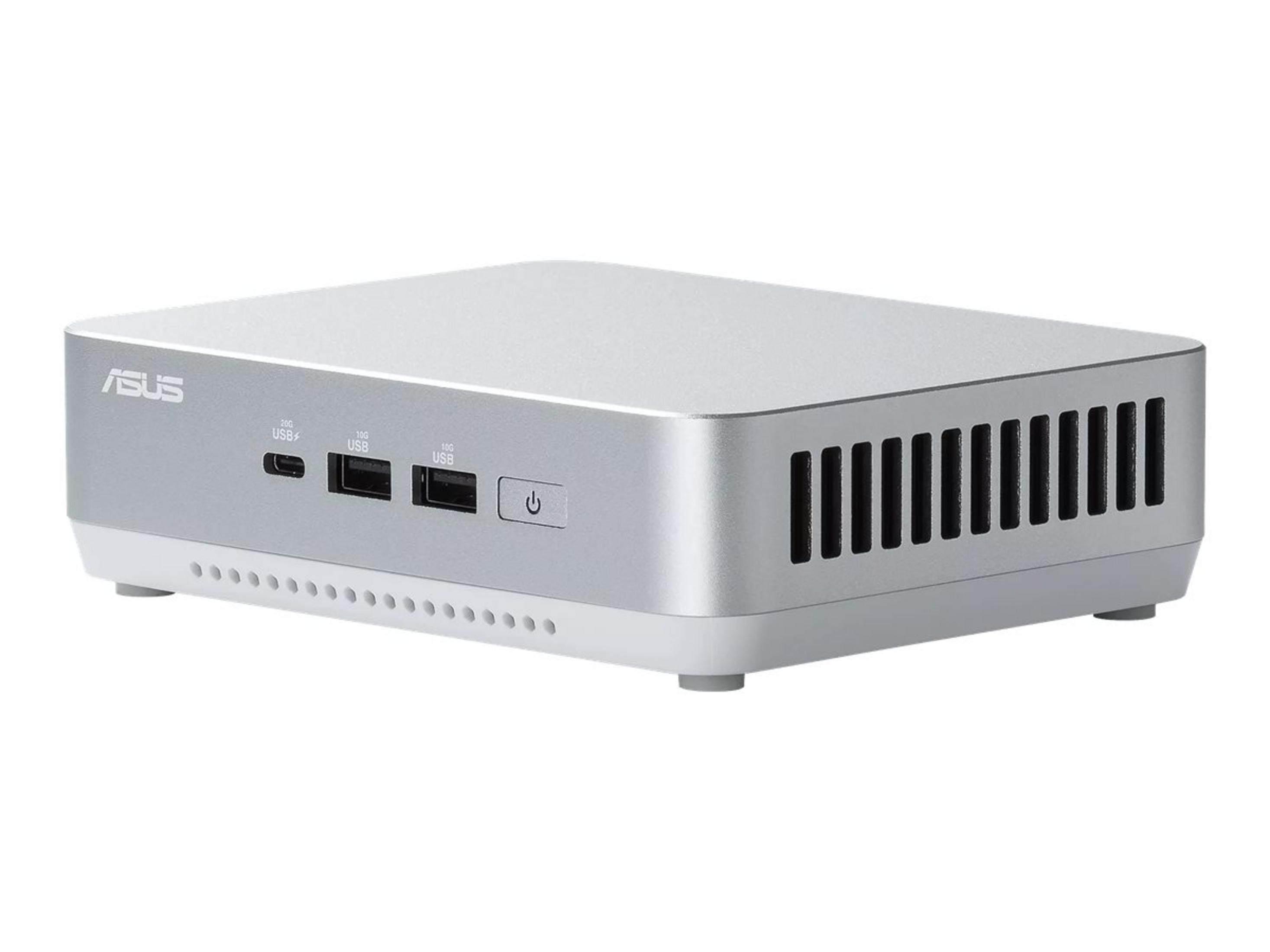 A silver Asus Mini PC with USB ports and a power button.