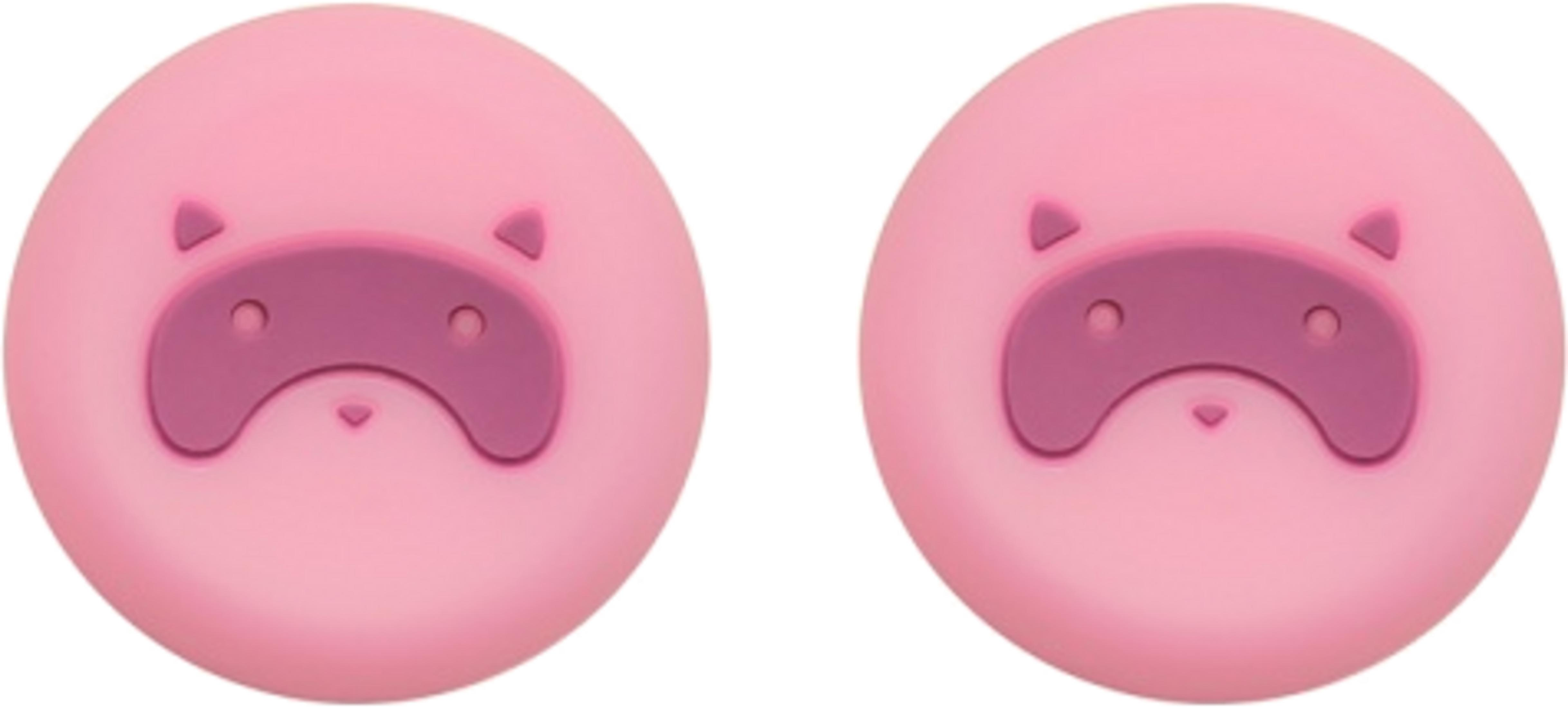 Dos caras de cerdo rosas con antifaces y orejas más oscuras.
