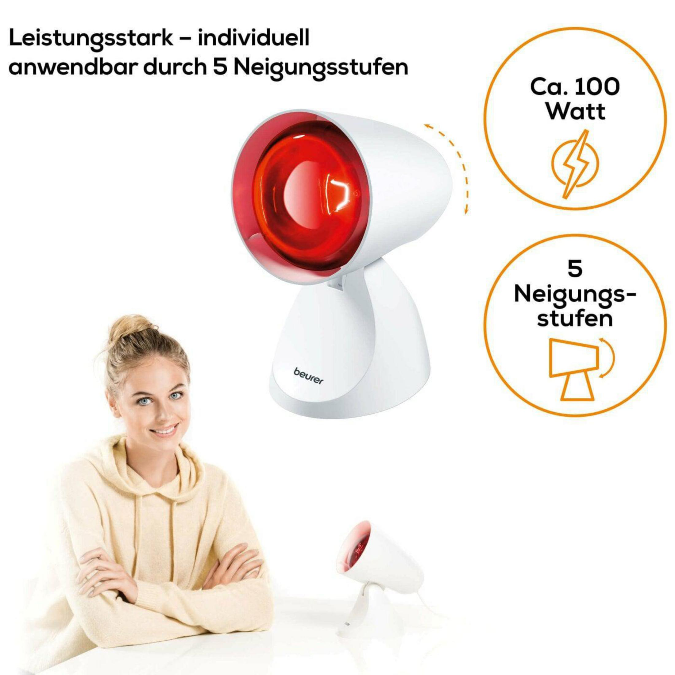 Ein Beurer Infrarotlichtgerät mit rotem Licht steht auf einem Tisch.