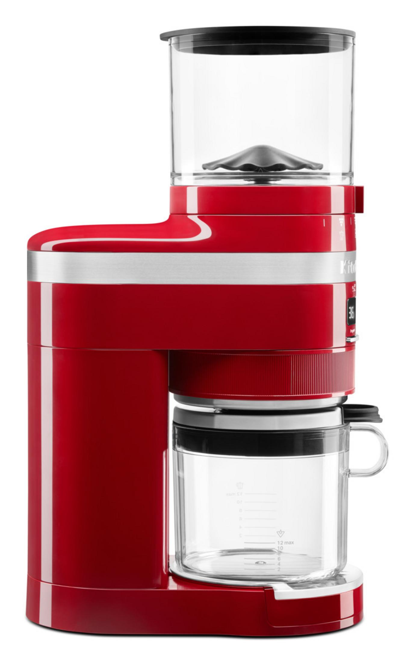Rote Küchenmaschine mit Glasbehälter und Mahlwerk oben.