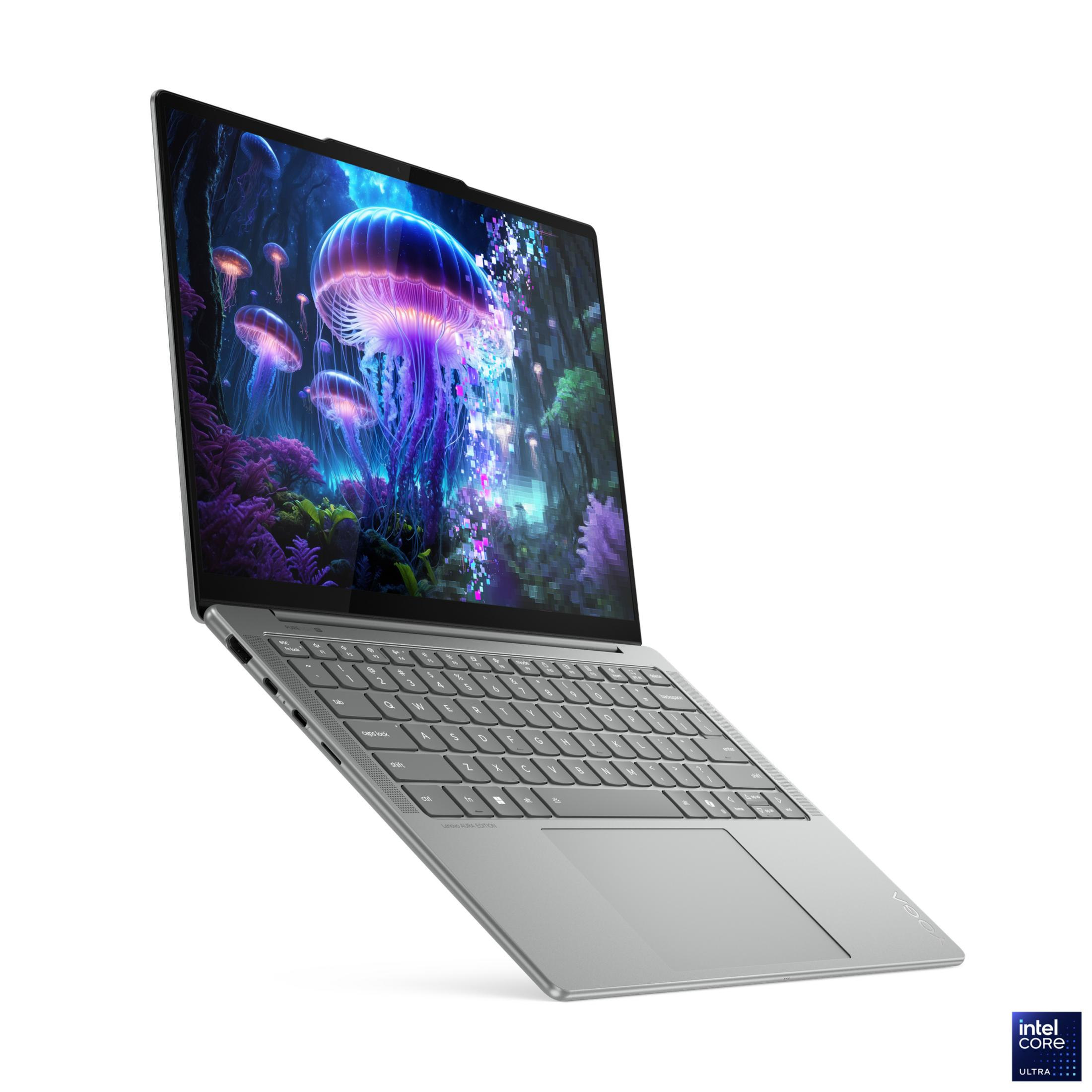 Srebrny laptop z żywym tłem z meduzami.