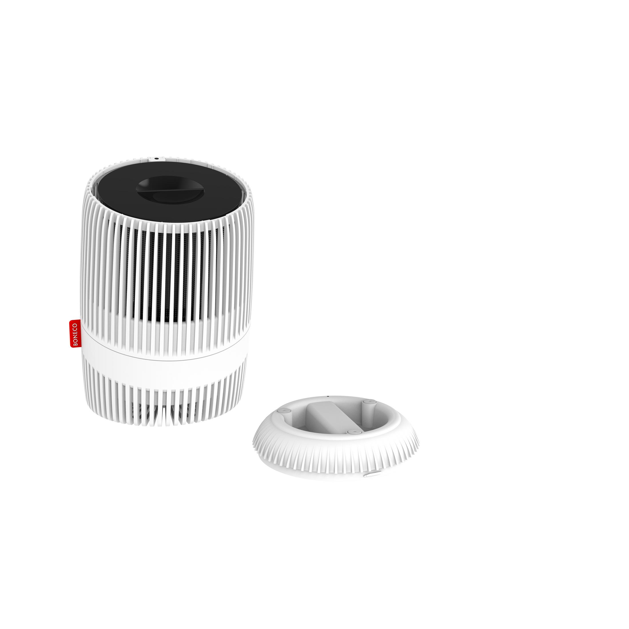 Un umidificatore bianco a lamelle con coperchio staccato accanto.