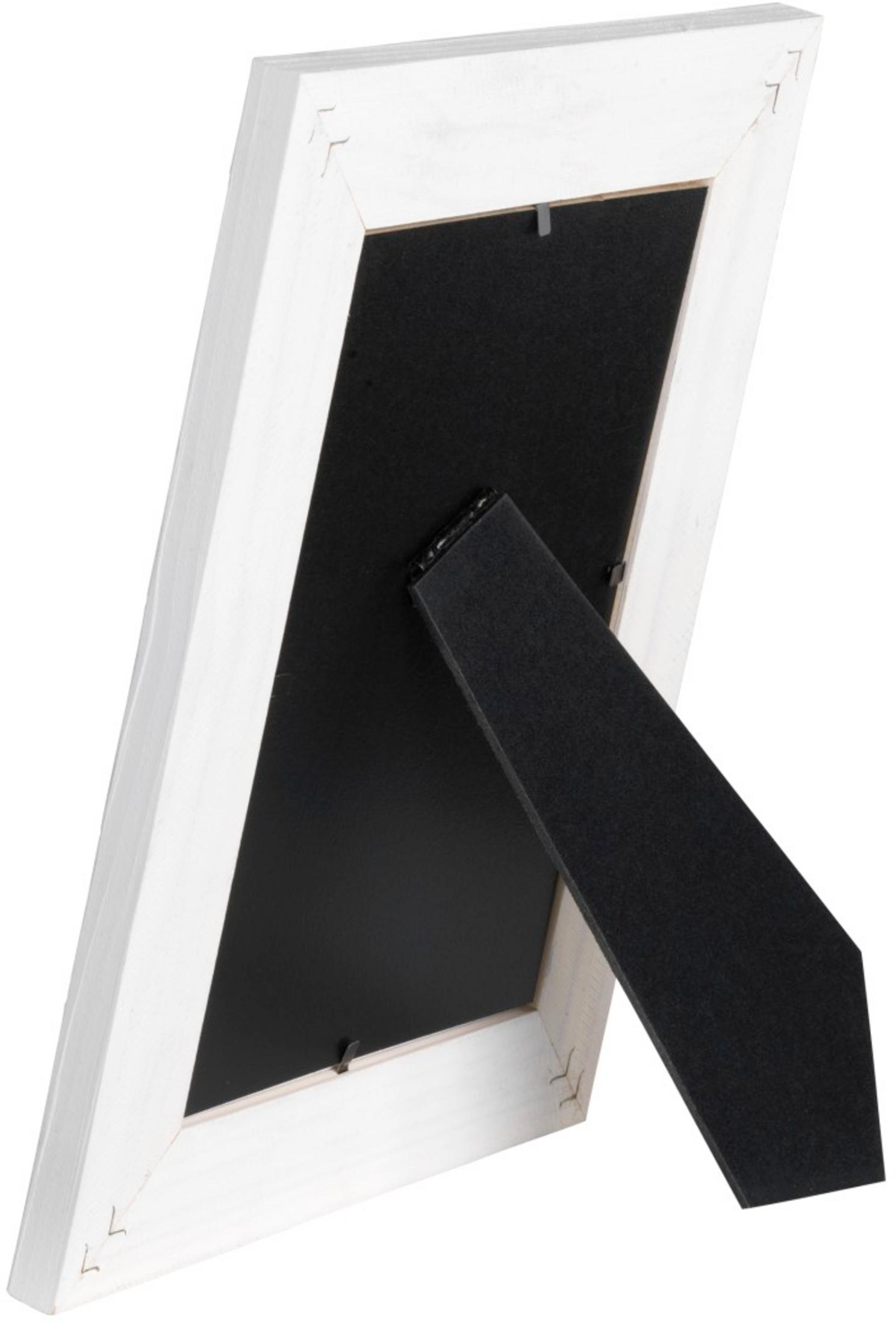 Arrière d'un cadre blanc avec insert noir et pied.
