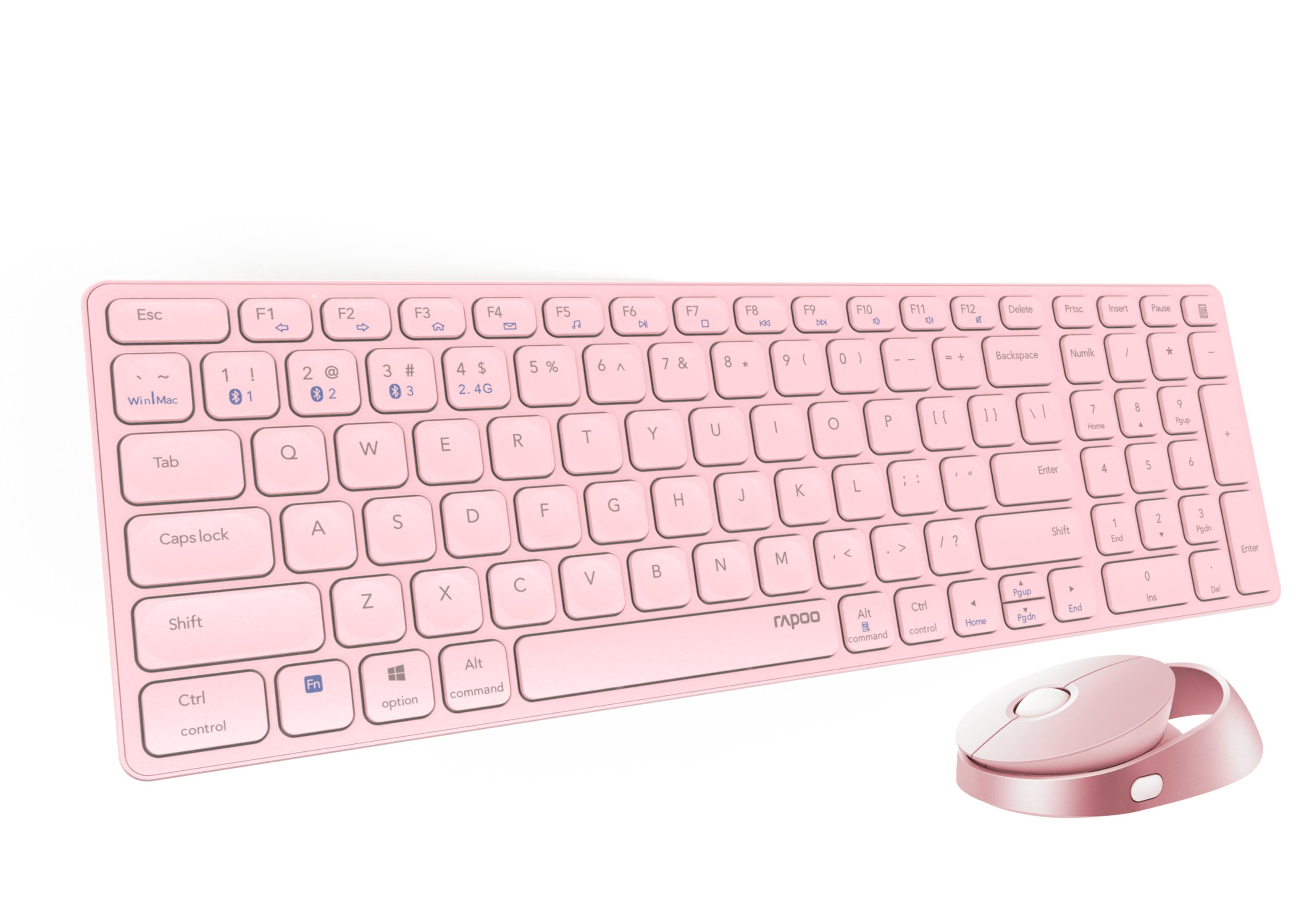 Un set di tastiera e mouse wireless rosa riposa su sfondo bianco.
