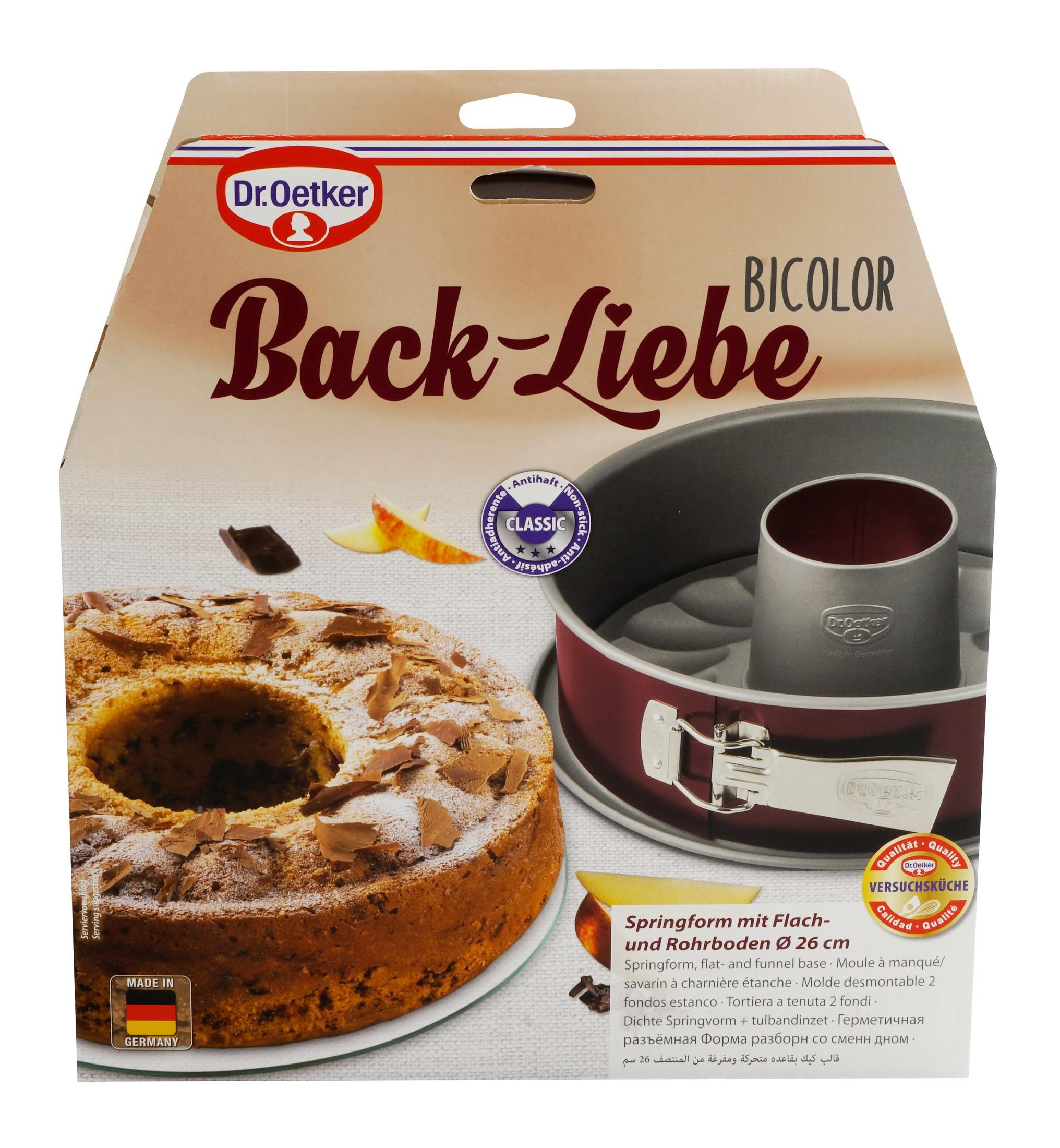 Dr. Oetker Kuchenform mit Kuchen, Schokostückchen und Apfelscheiben.