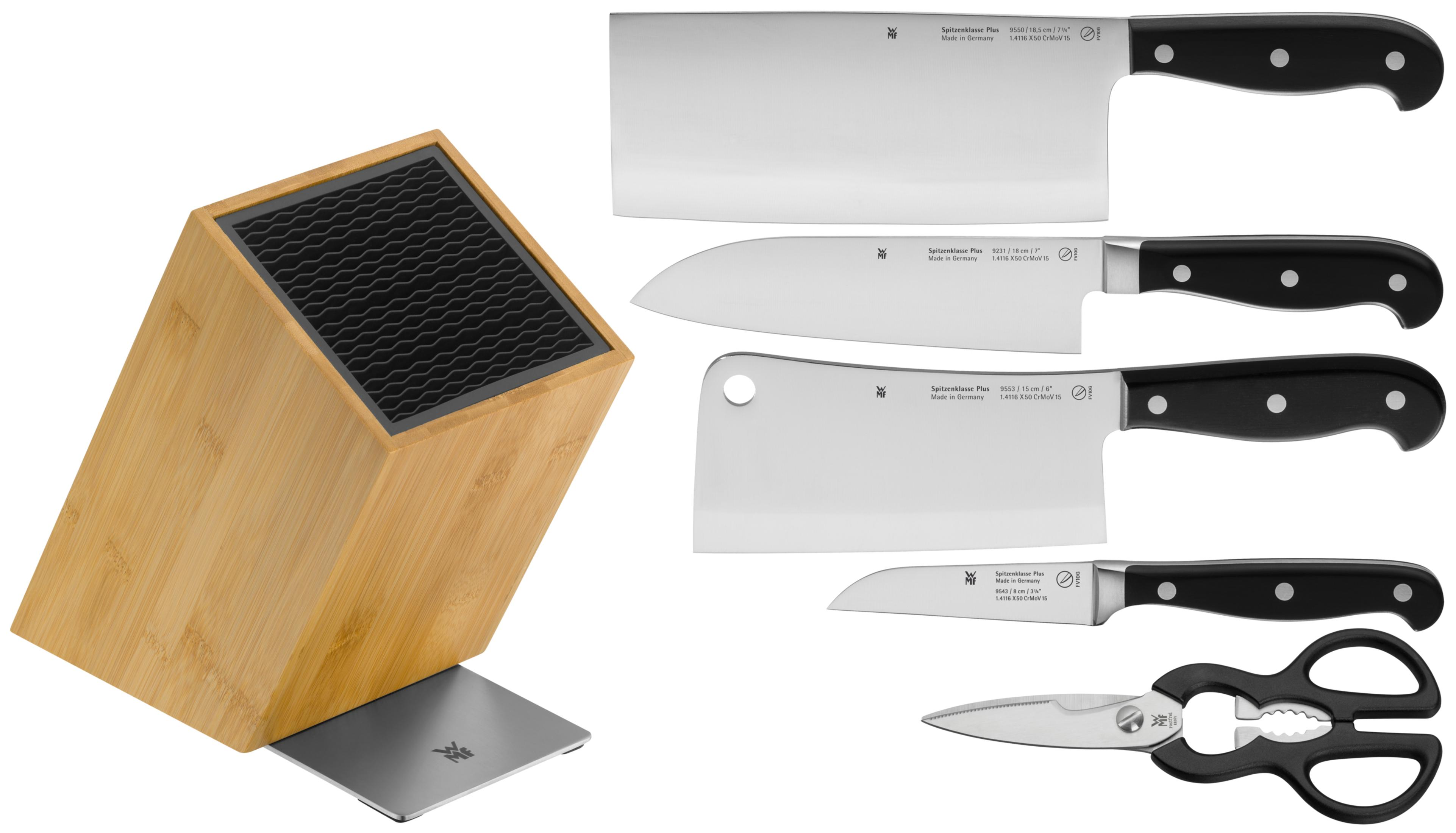 Ein Holzmesserblock mit einem Metalleinsatz und vier WMF-Messern und einer Schere.