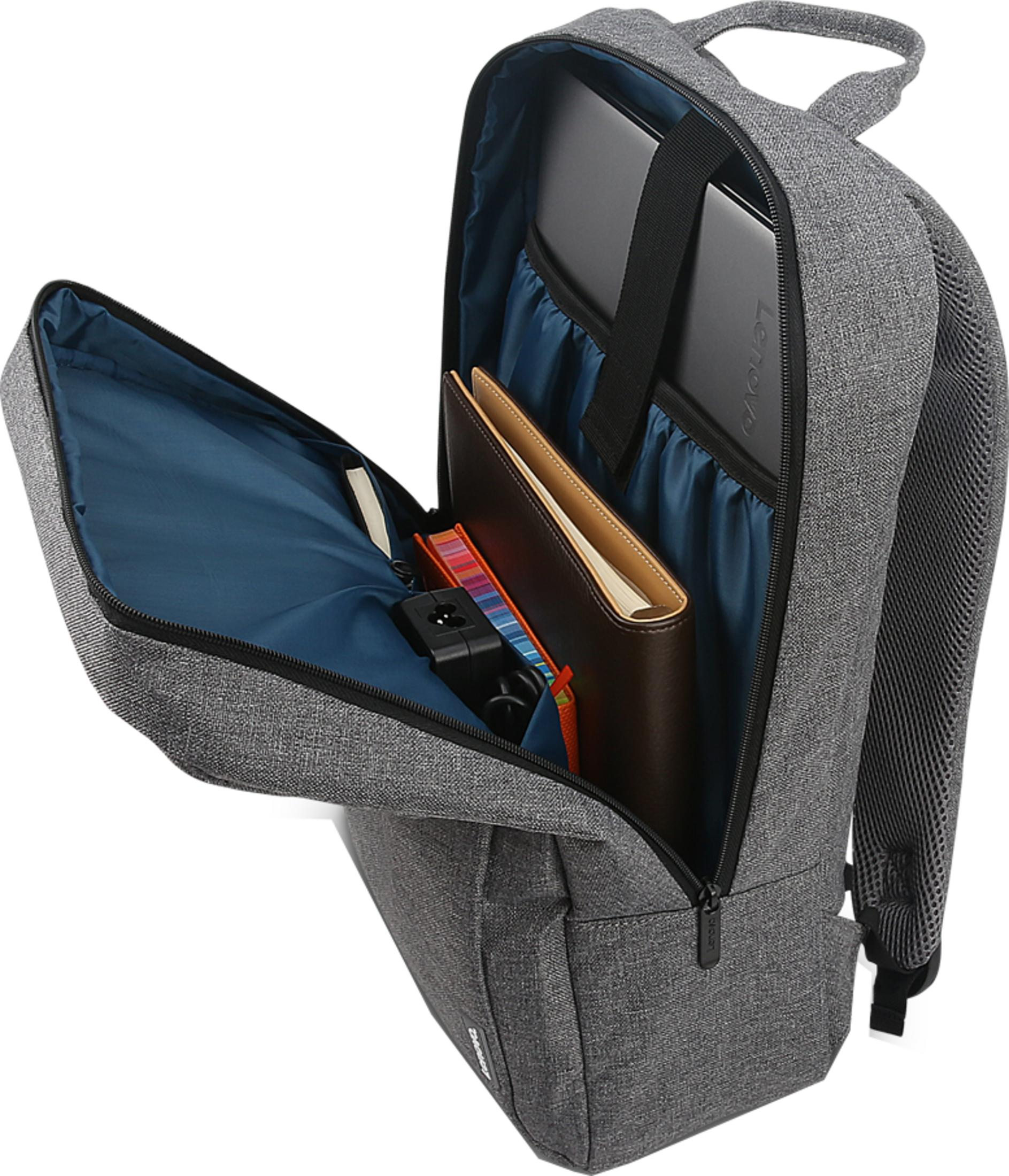 Sac à dos gris avec compartiment ouvert, ordinateur portable, carnet et chargeur