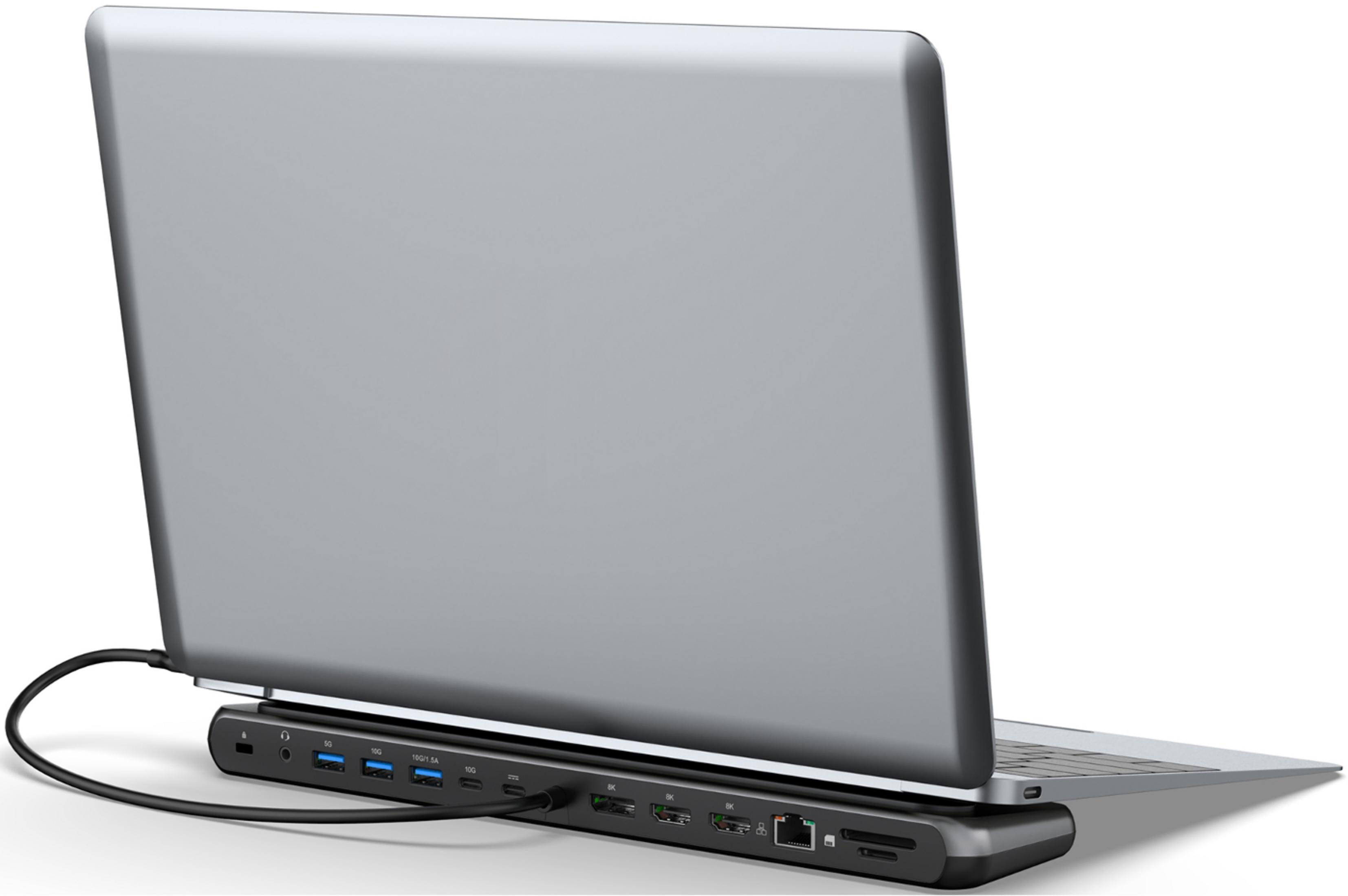 Ein graues Laptop mit Dockingstation, das mit einem Kabel verbunden ist.