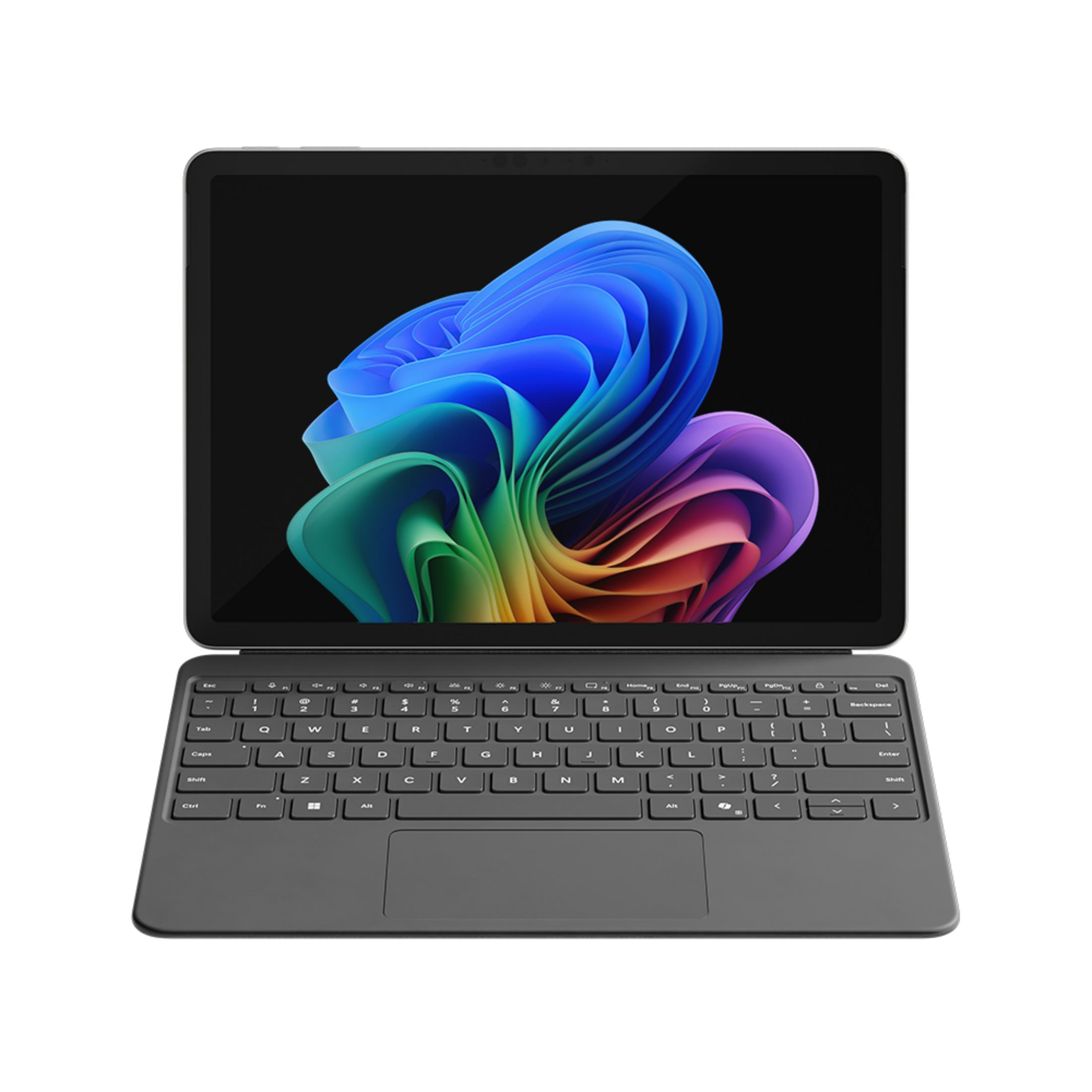 Un tablet grigio con tastiera collegata mostra uno sfondo astratto colorato.