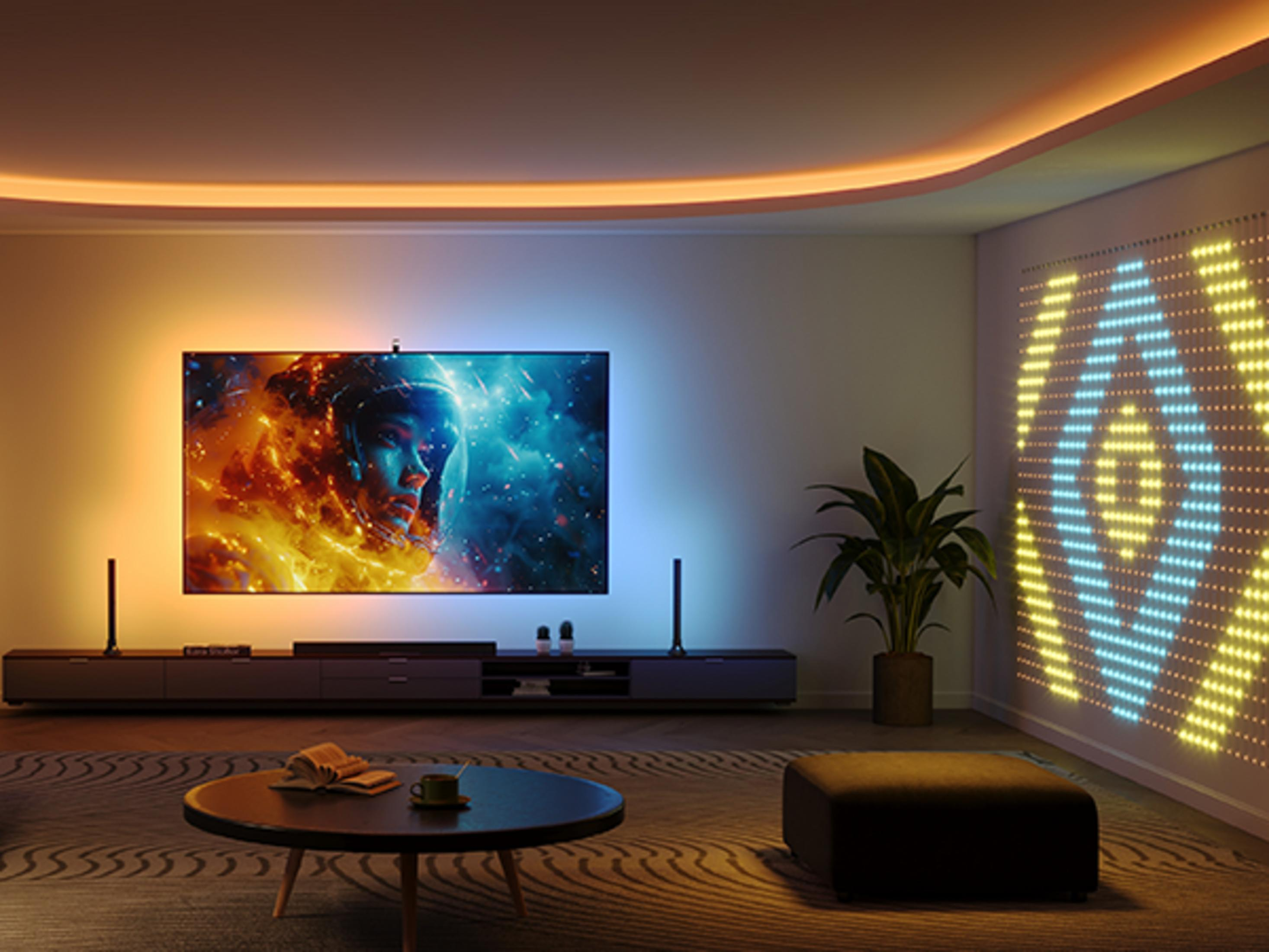 Uzay görüntüsü gösteren büyük bir TV'li modern oturma odası.