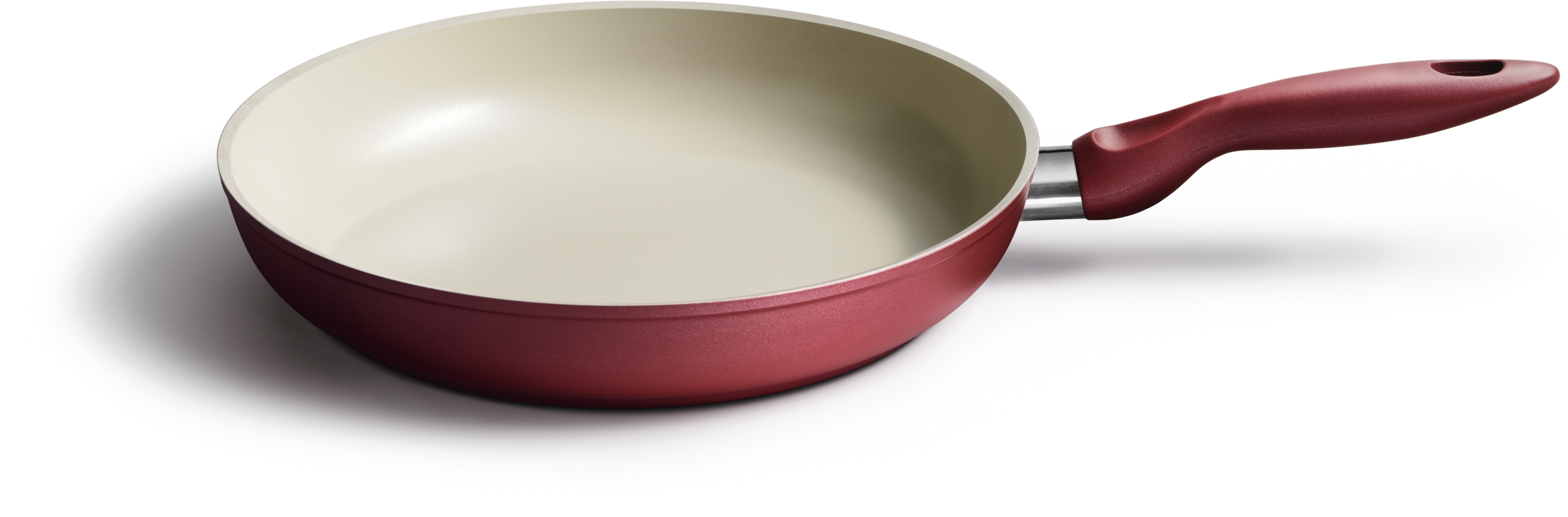 Rote Bratpfanne mit cremefarbener Innenseite und rotem Griff.