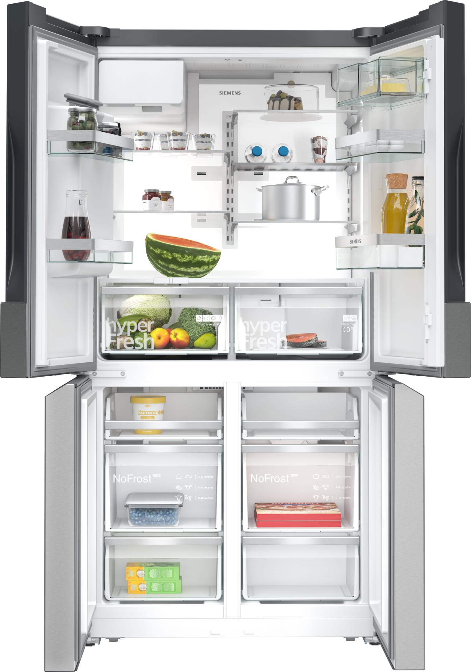 Refrigerador Siemens abierto con fruta, verduras, pescado, pastel, botellas y helado.