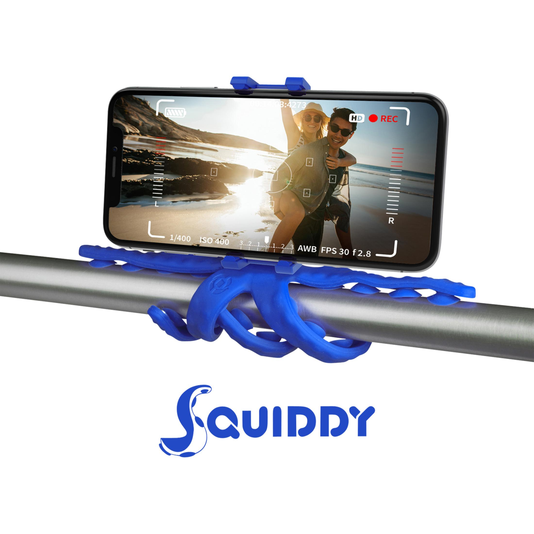 Blauer Oktopus-Handyhalter hält ein Handy mit einem Paar auf einem Strand.
