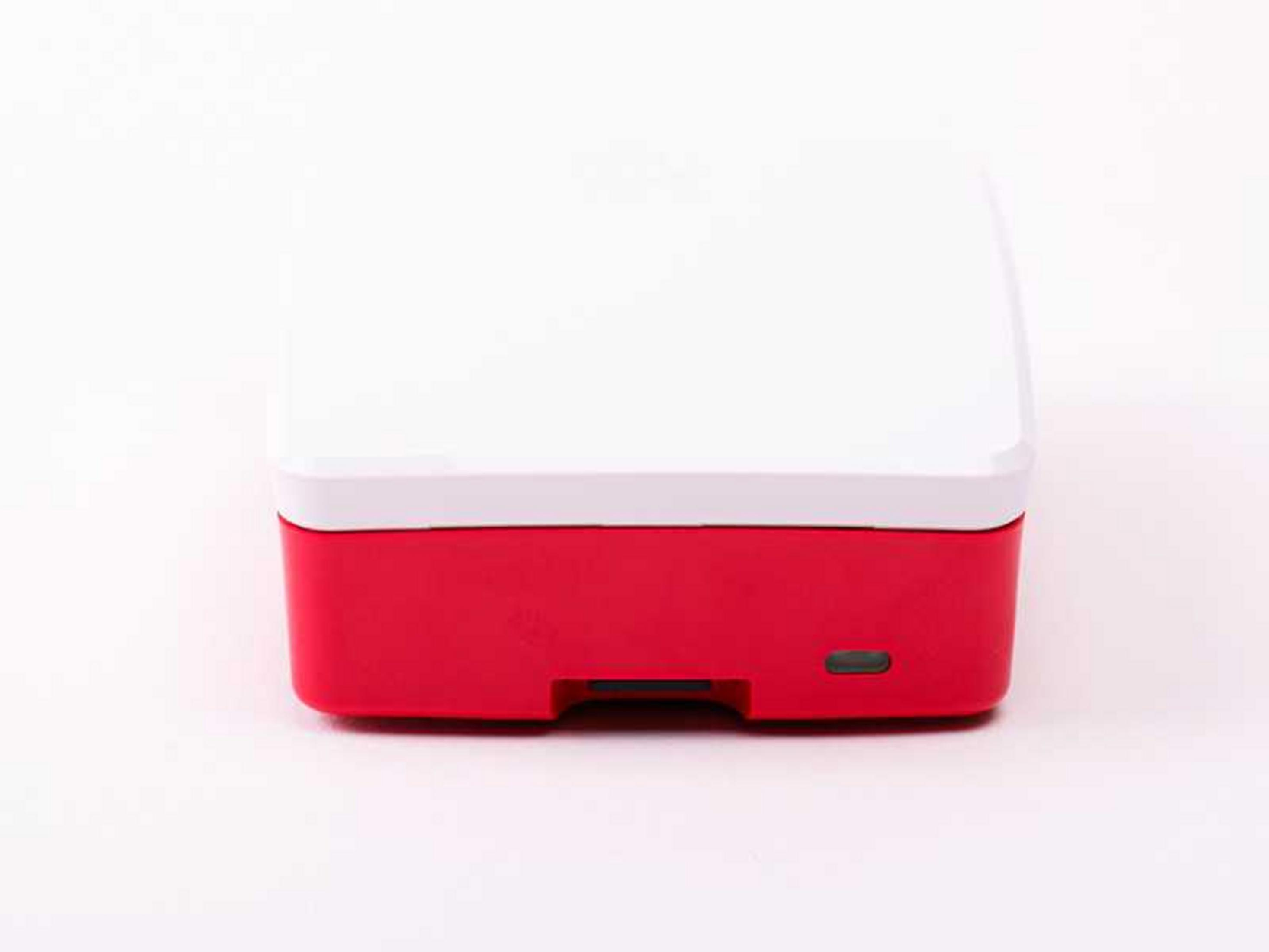 Una caja roja con tapa blanca sobre fondo blanco.