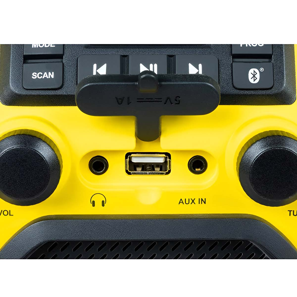 Żółte urządzenie z przyciskami: USB, wejście Aux, pokrętło głośności, gniazdo słuchawkowe.