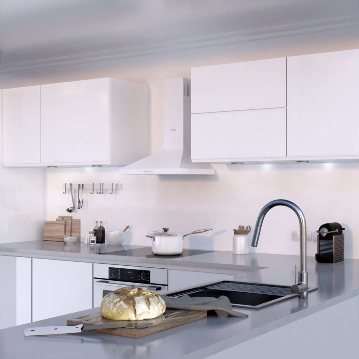 Modern kitchen with white cabinets, bread on cutting board and sink.
