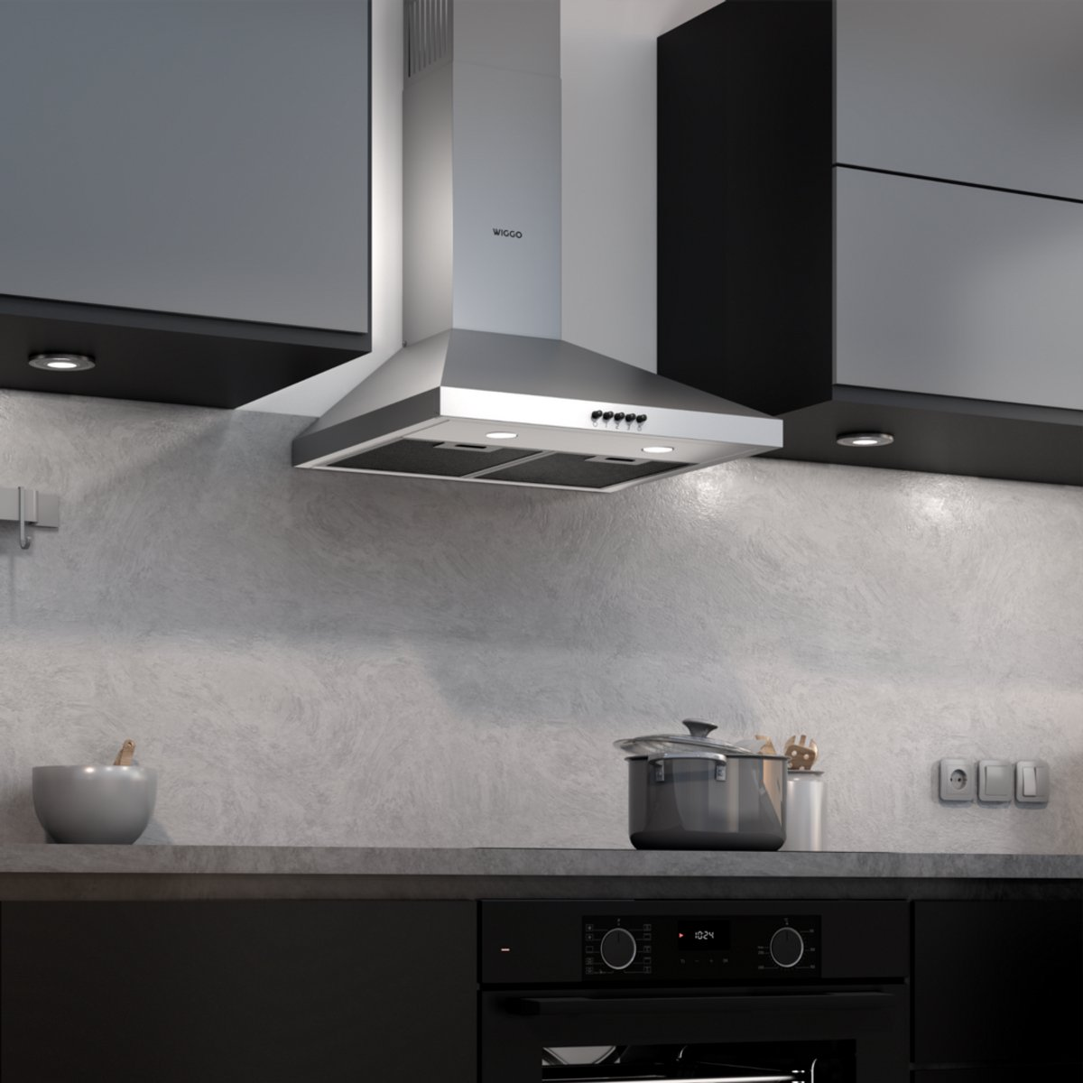 Cuisine moderne avec hotte aspirante en acier inoxydable, comptoir gris et armoires noires.