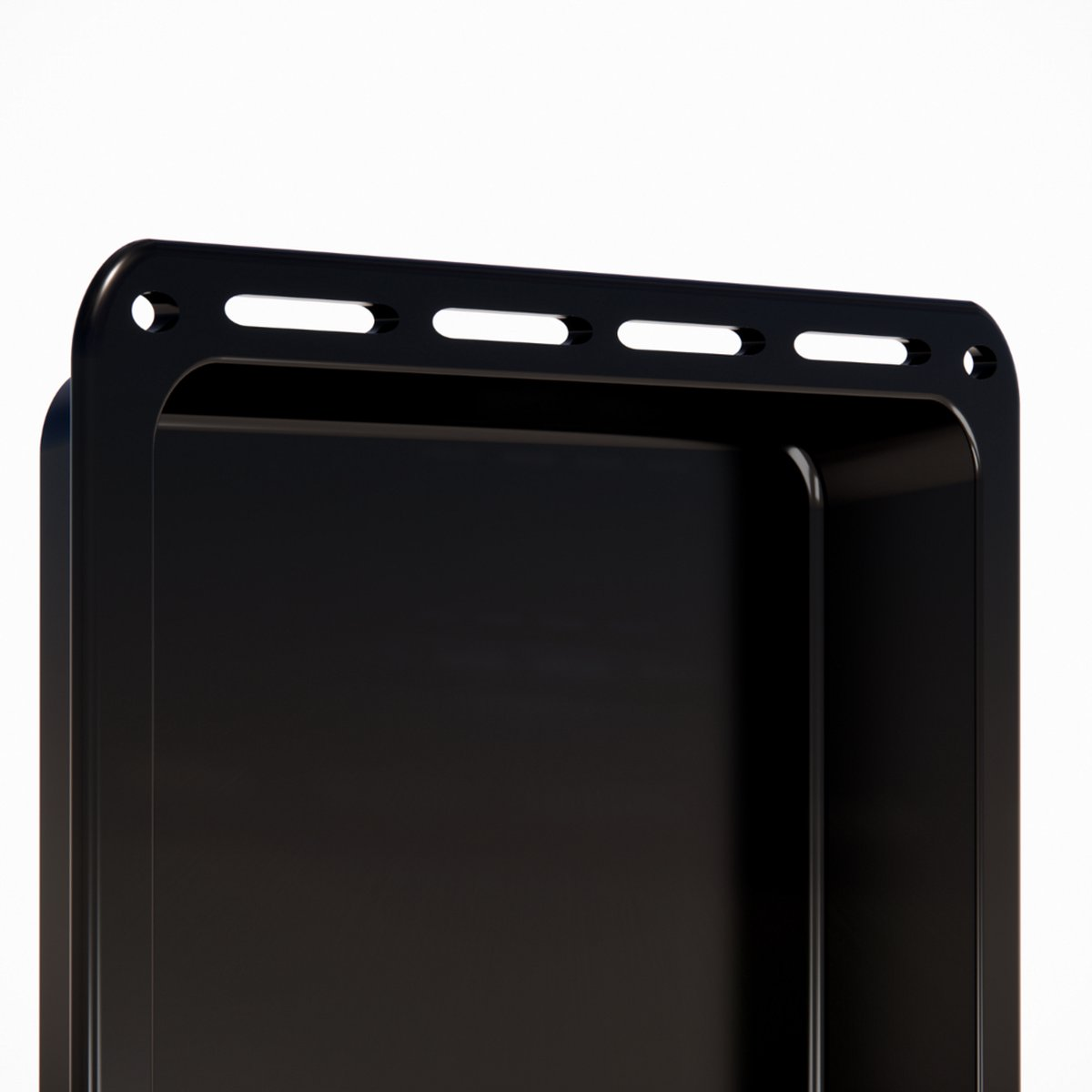Black baking tray with slots on the top edge, close-up.