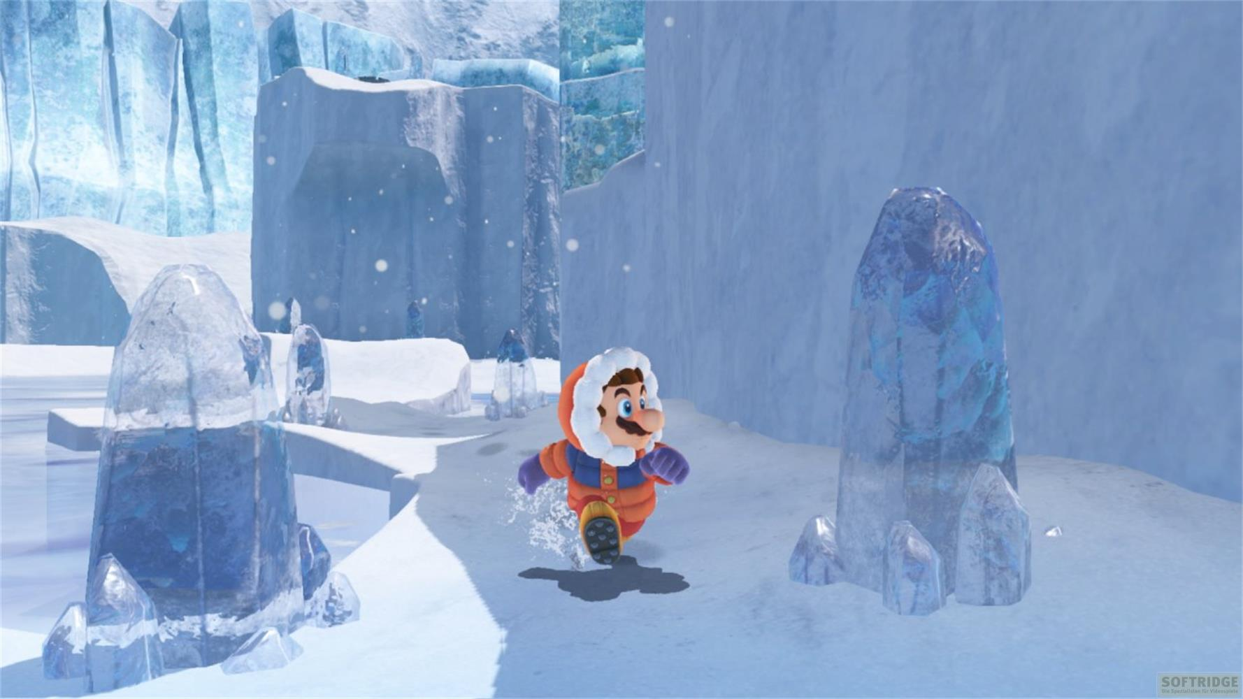 Mario in Winterkleidung rennt durch eine eisige Landschaft mit gefrorenen Säulen.