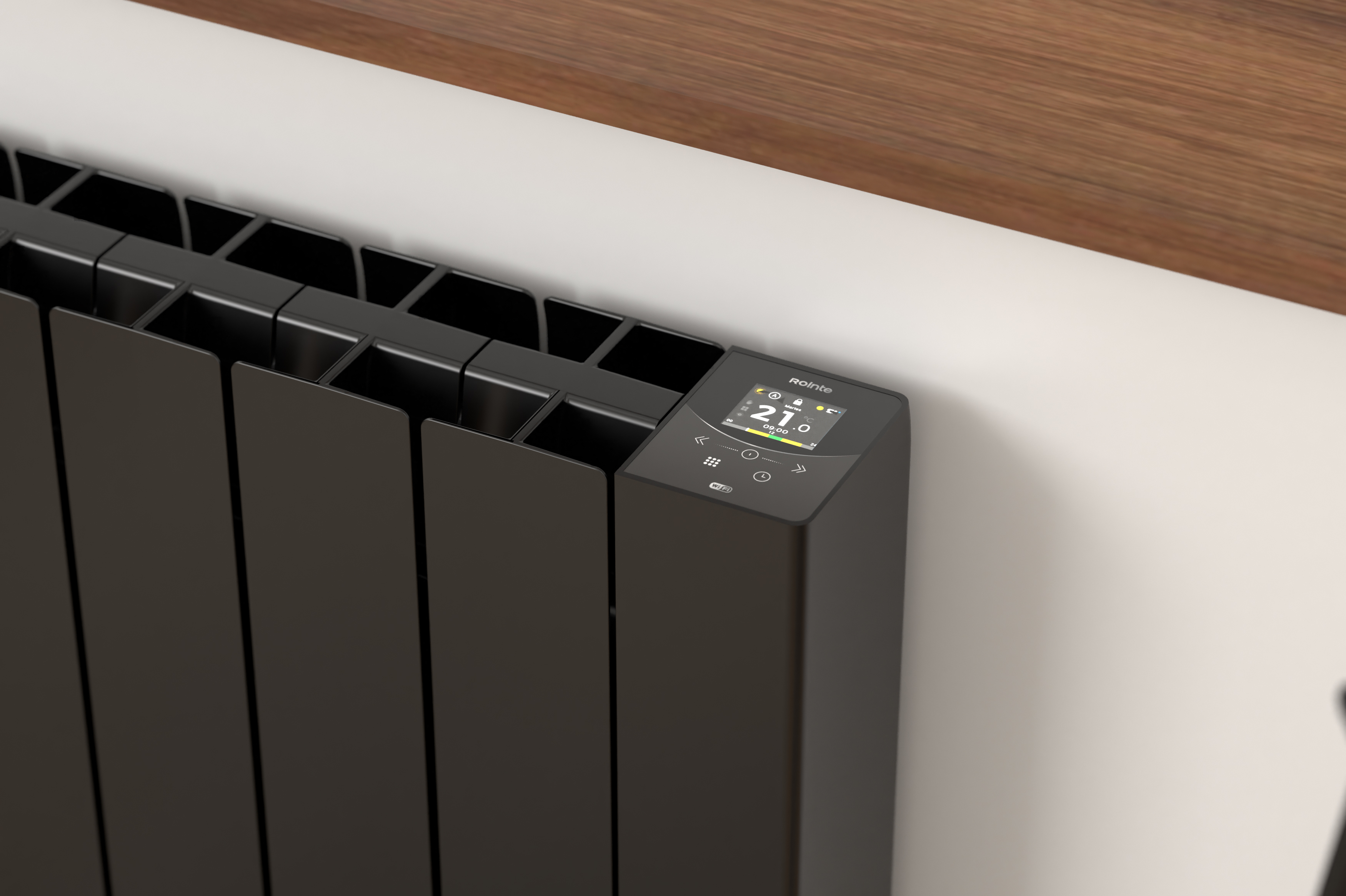 Un radiador negro con pantalla digital muestra 21 grados.