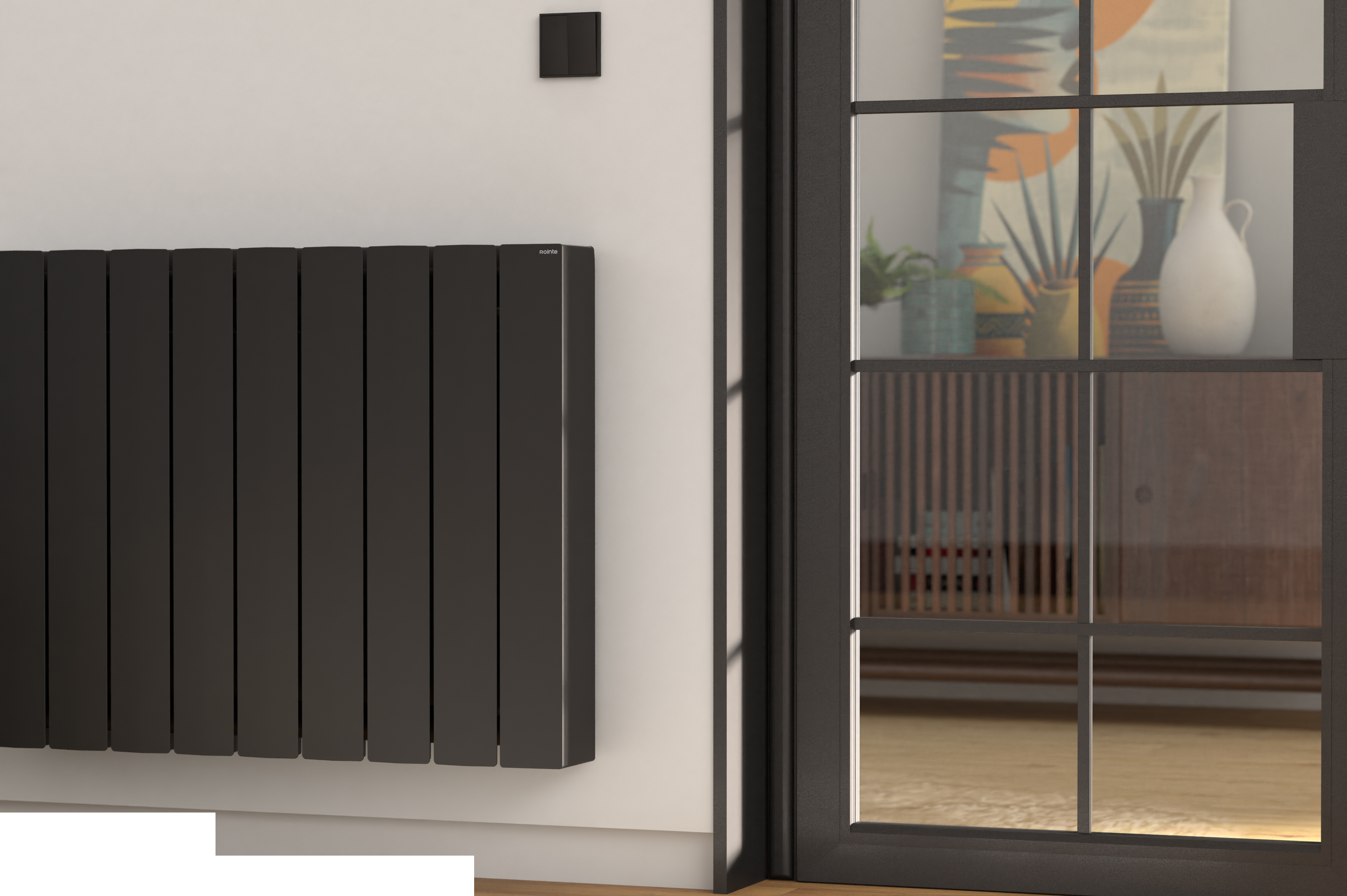Un radiador negro en una pared blanca junto a una puerta de cristal que muestra una habitación.