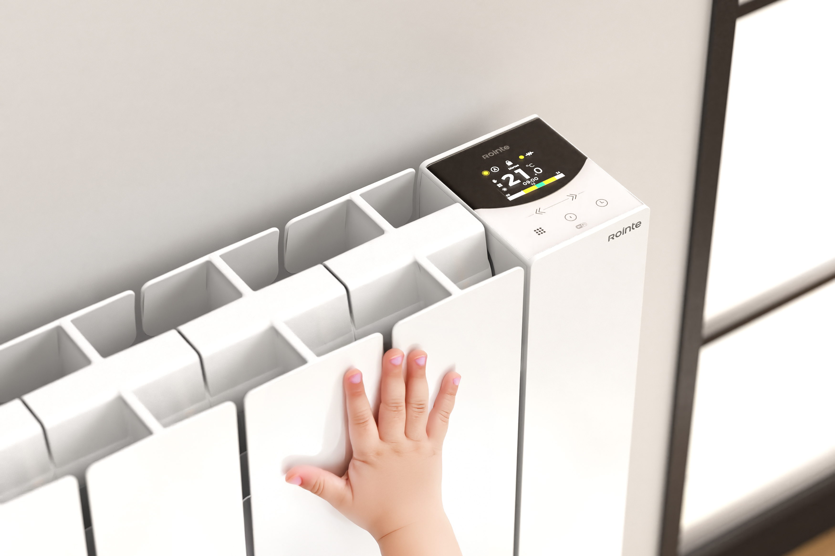 El dedo de un bebé toca un radiador blanco con pantalla digital.