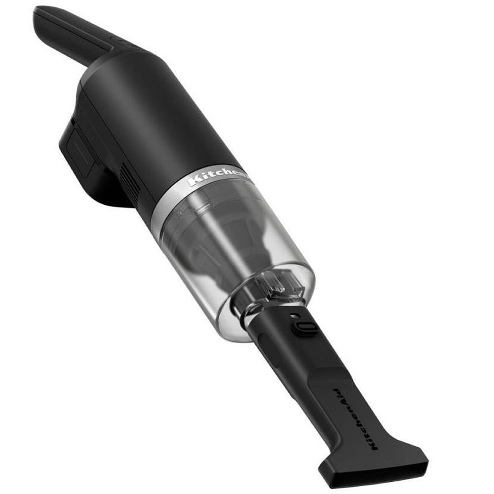 Şeffaf toz haznesine sahip siyah KitchenAid el süpürgesi.