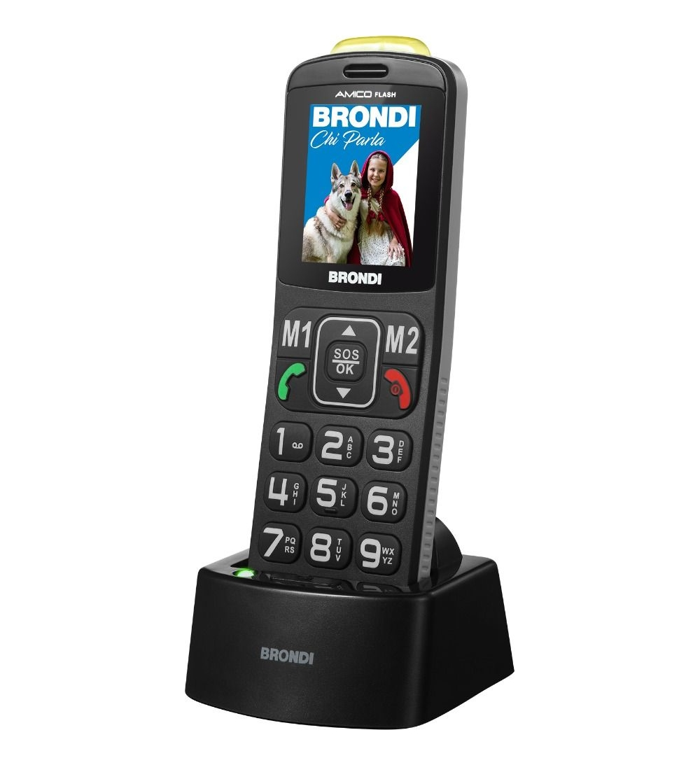 Un telefono Brondi con tasti grandi e una foto di una bambina con un cane.