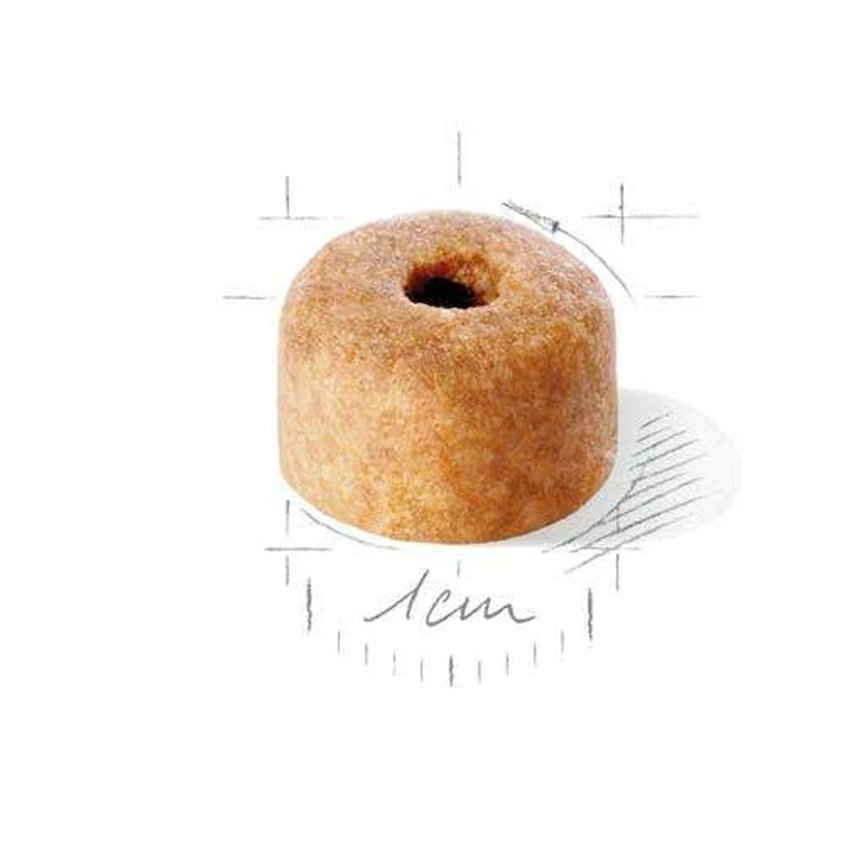 Una sola croqueta cilíndrica para perros con un agujero en el centro.