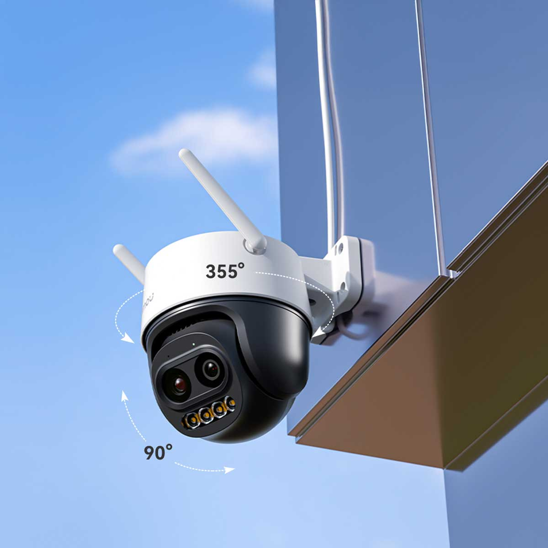 A security camera with 355° and 90° rotation against a blue sky.