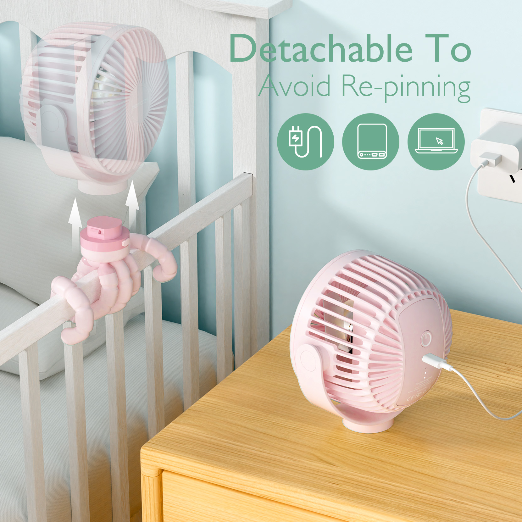 Ein rosa Ventilator ist am Kinderbett befestigt, ein weiterer steht auf einem Nachttisch.
