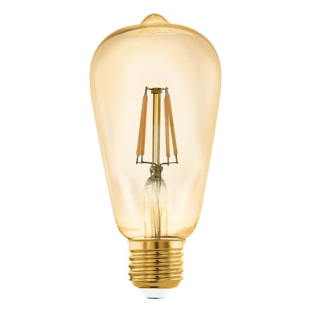 Una lampadina Edison color ambra con filamenti visibili e base filettata dorata.