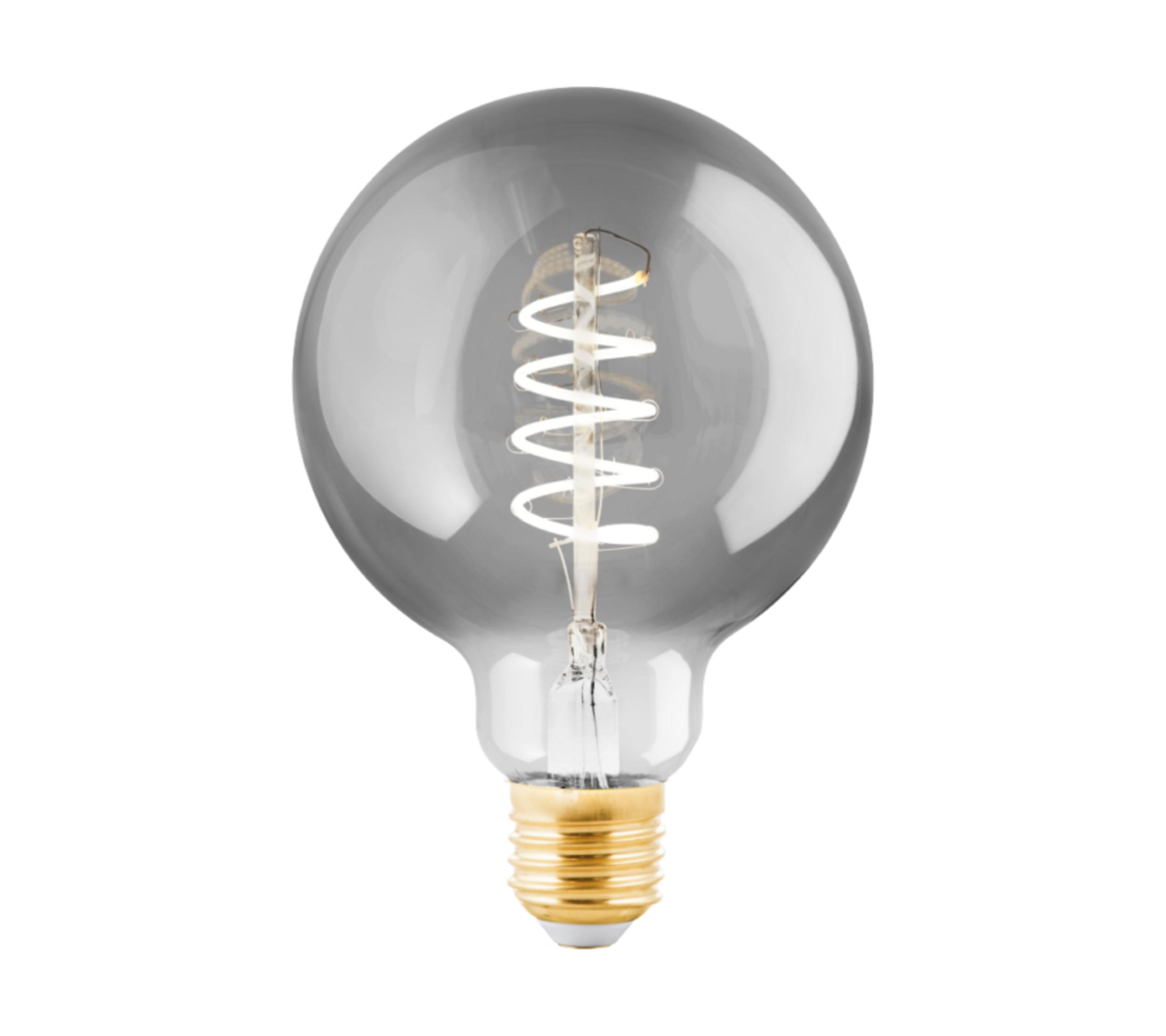 Una lampadina grigia con base dorata e filamento visibile.