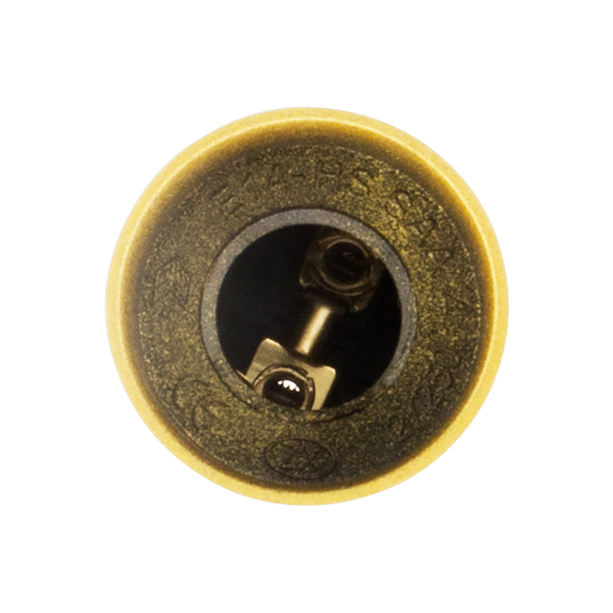 Cilindro color ottone con interno scuro e meccanismo metallico.