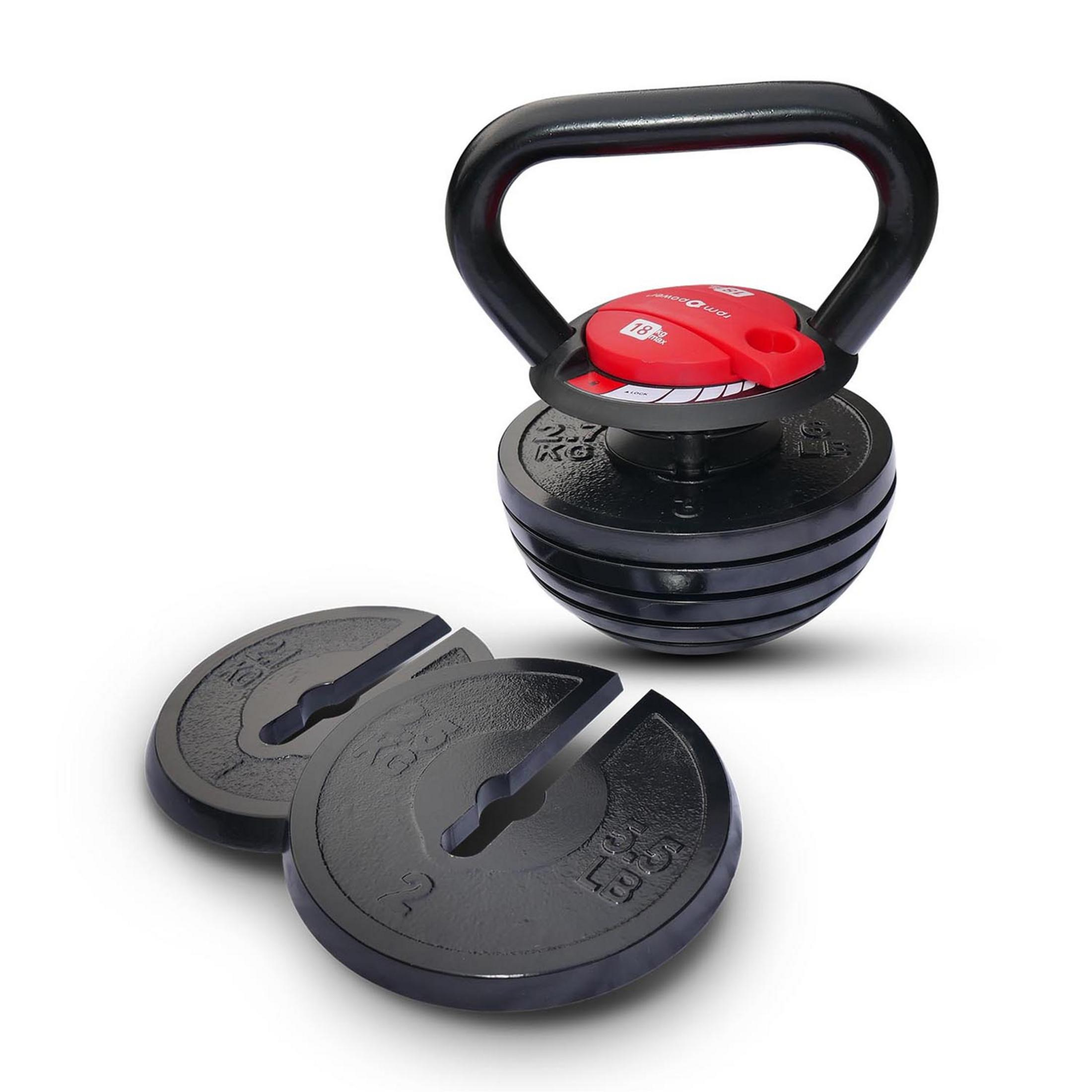 Un kettlebell regolabile con clip rosse e pesi sciolti.