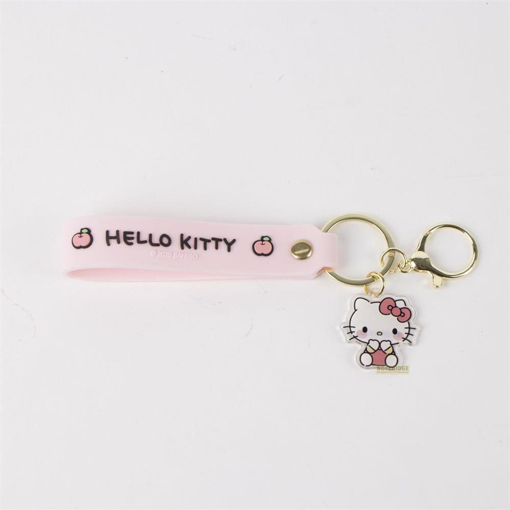 Un llavero rosa de Hello Kitty con una figura pequeña.