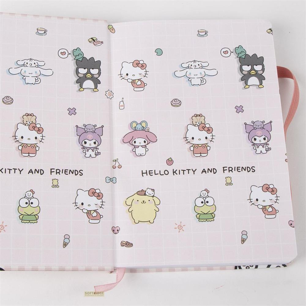 Libreta abierta con patrón de rejilla rosa con personajes Kawaii como Hello Kitty.