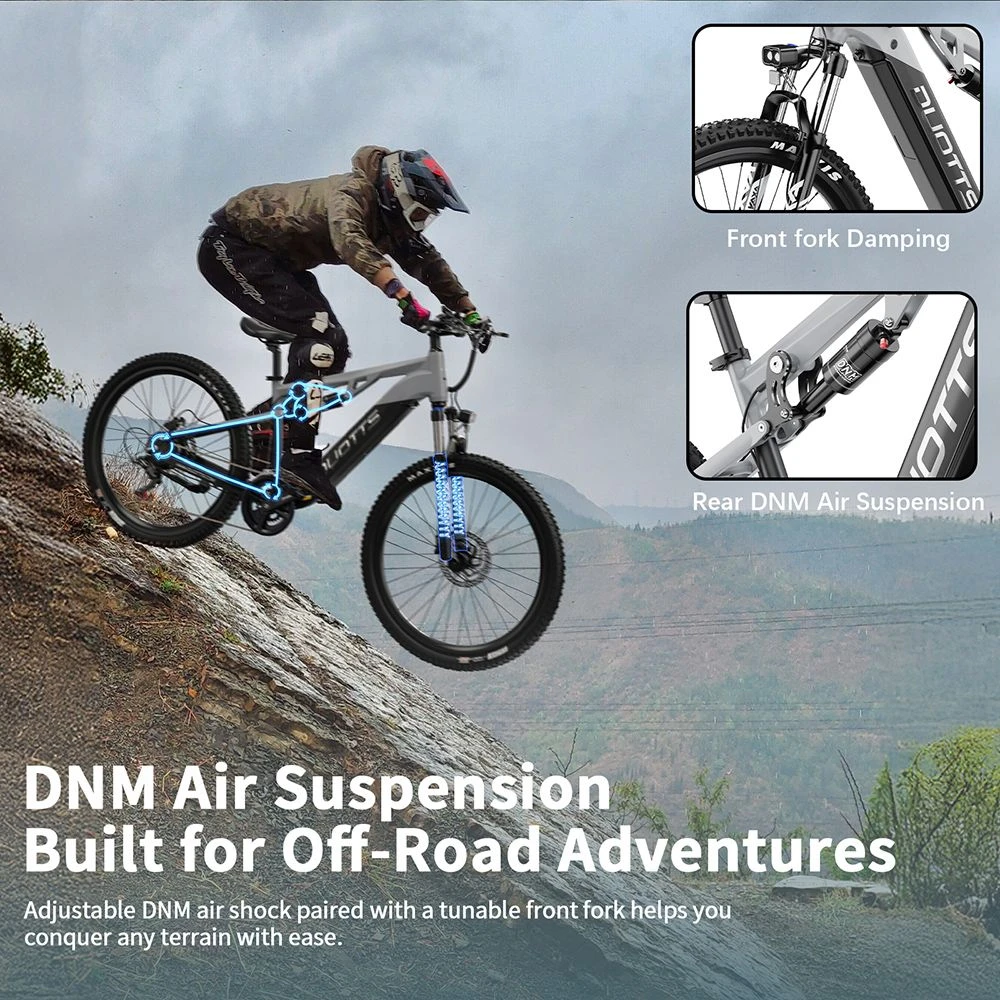 Una persona monta una bicicleta gris con suspensión de aire DNM por una pendiente rocosa.