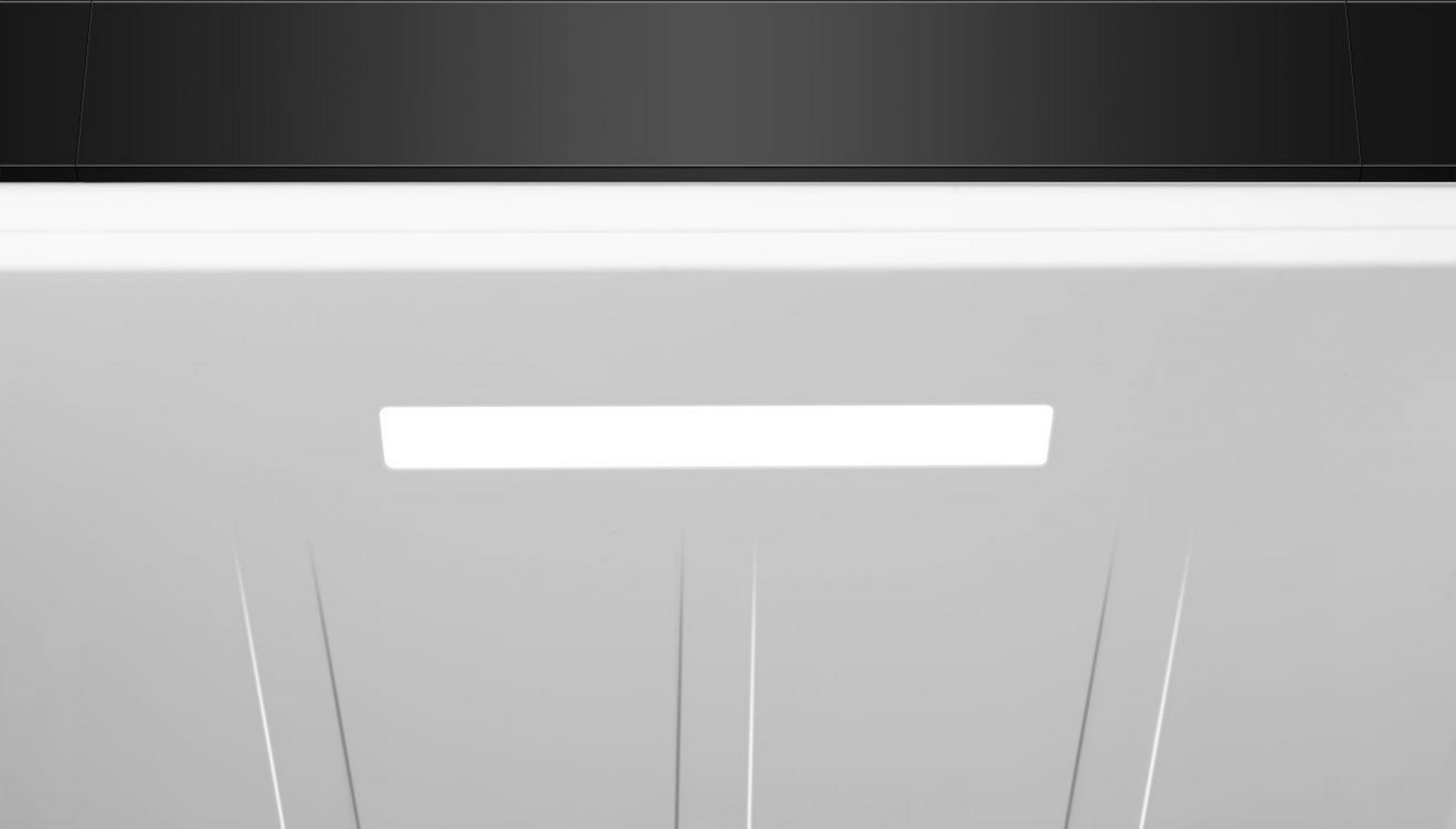 Refrigerador blanco con borde superior negro y una tira de luz brillante.