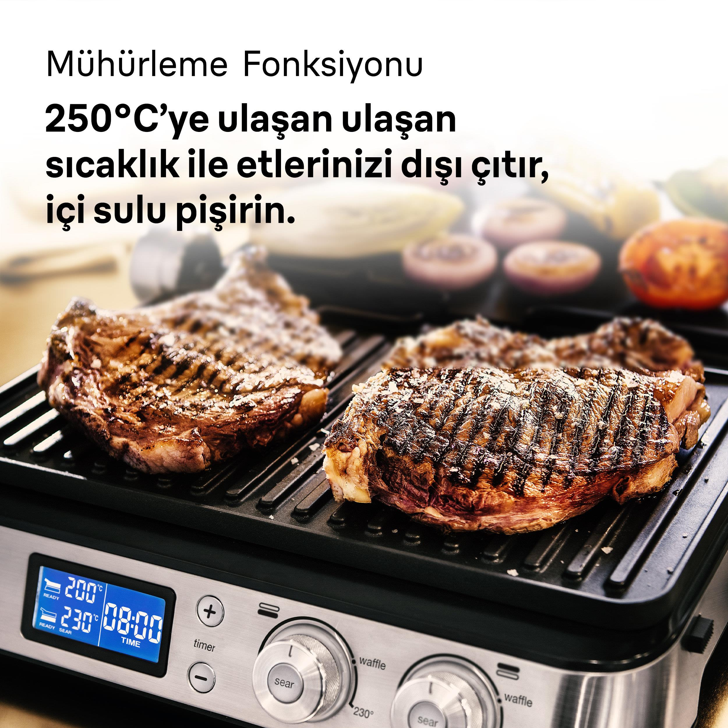 Zwei Steaks werden auf einem Grillrost gegrillt, der auf 230°C eingestellt ist.