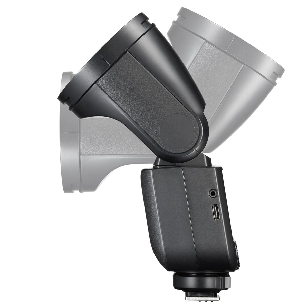 Un flash per fotocamera nero con testa regolabile, con un flash pallido sullo sfondo.