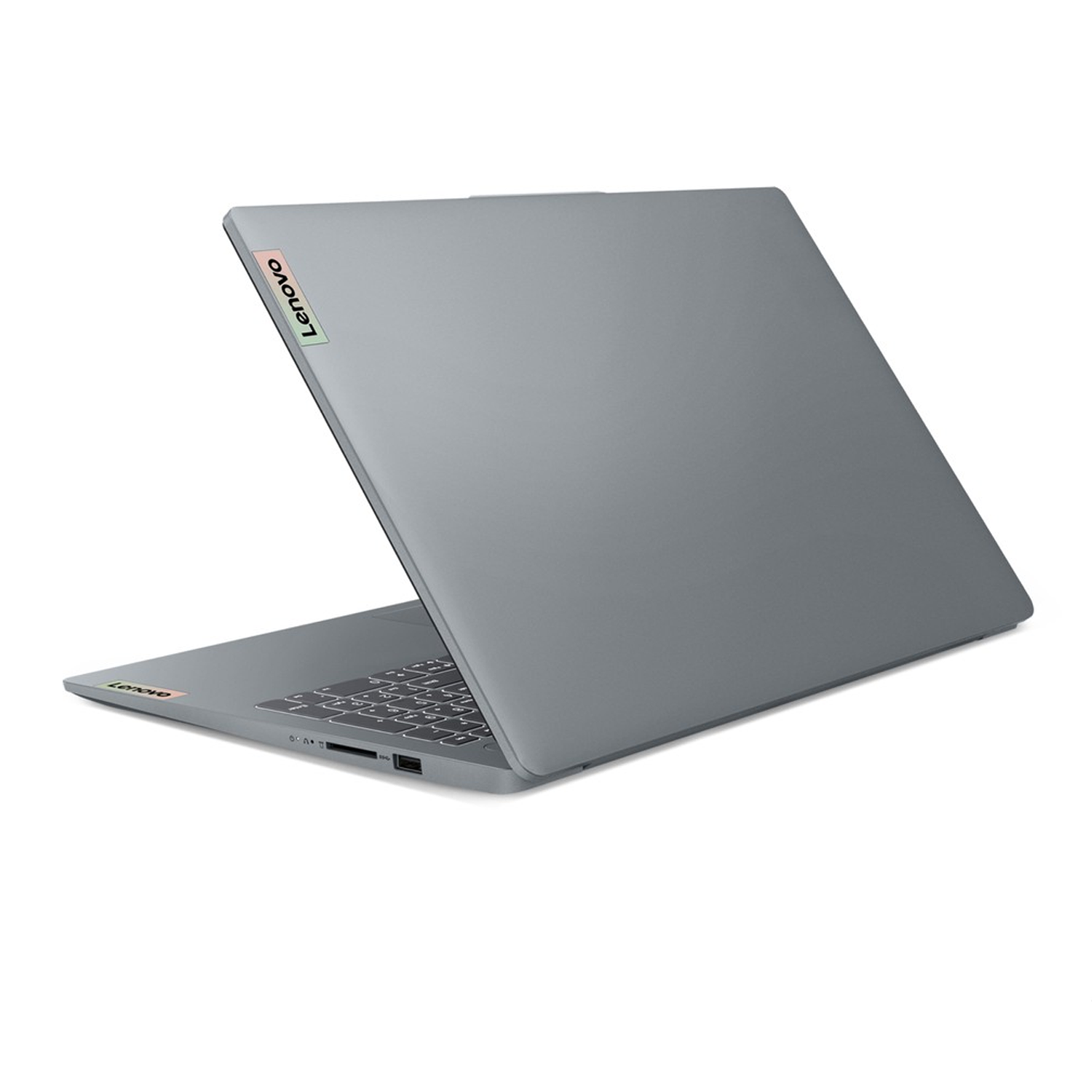 Beyaz arka plan üzerinde yandan görünen kapalı gri Lenovo dizüstü bilgisayar.