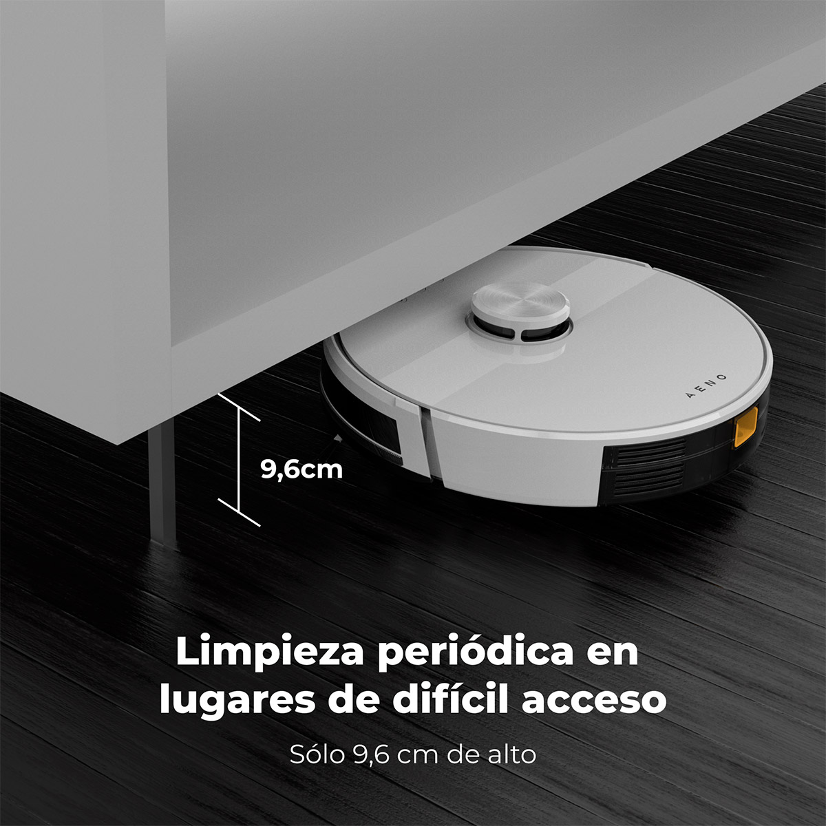 Biały robot sprzątający czyści pod niskim meblem. Wysokość 9,6 cm.