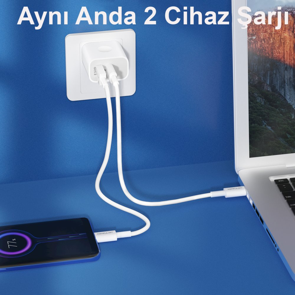 Beyaz bir duvar adaptörü aynı anda bir akıllı telefonu ve dizüstü bilgisayarı şarj eder.