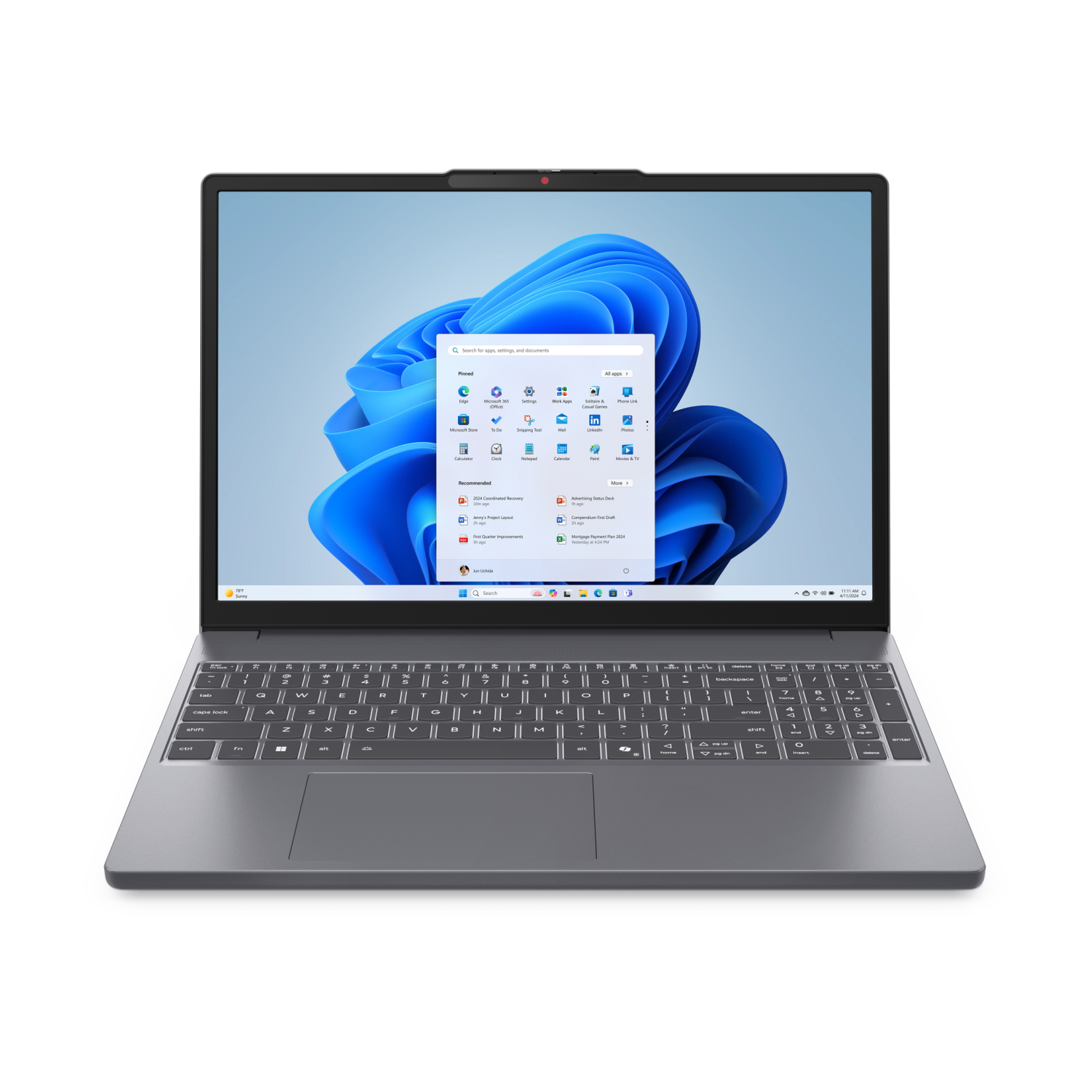 Szary laptop z otwartym ekranem, wyświetlający system Windows 11.