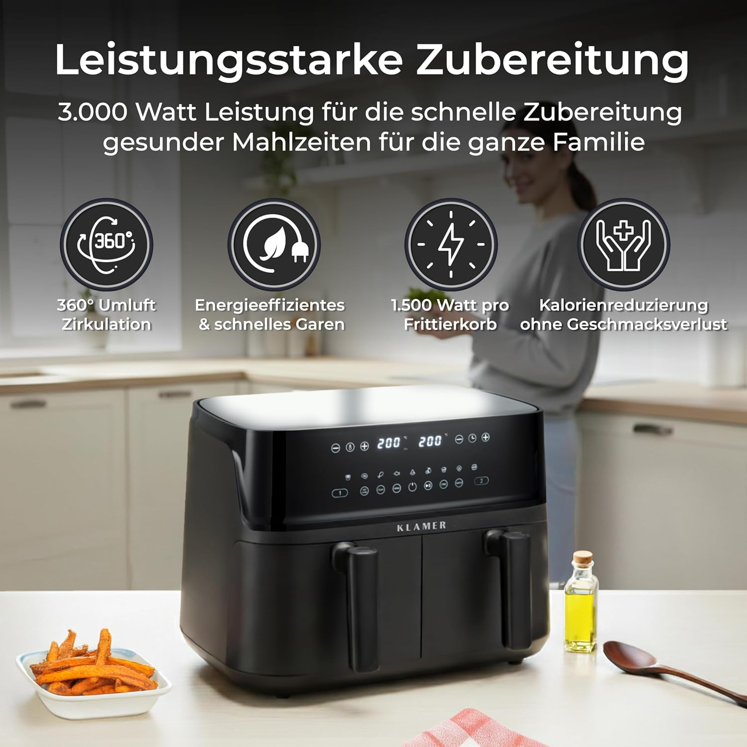 Ein schwarzer Heißluftfritteuse mit zwei Schubladen steht auf einem Tisch mit Süßkartoffelpommes und Öl.