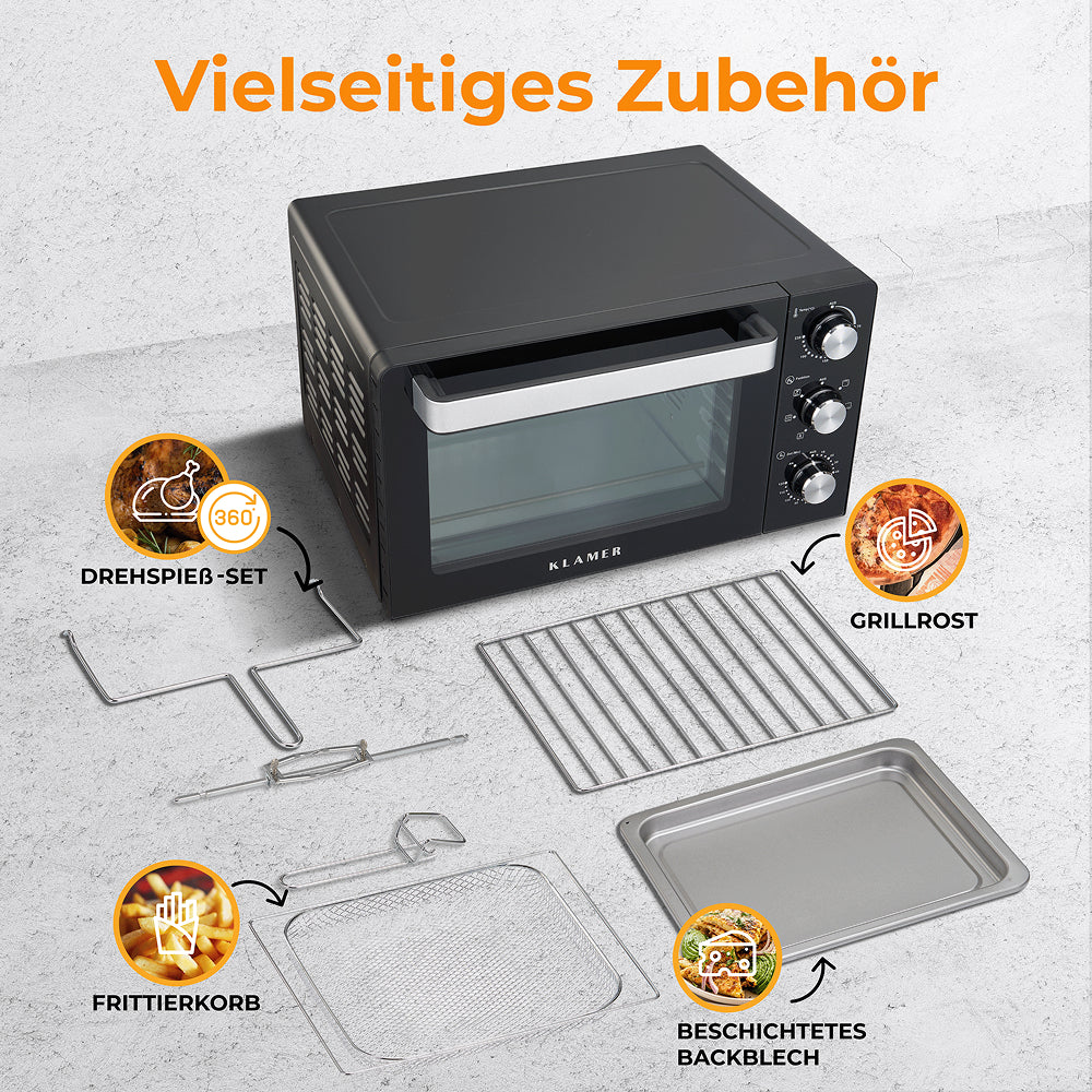 Ein schwarzer Tischbackofen mit Zubehör: Grillrost, Backblech, Frittierkorb, Drehspieß-Set.