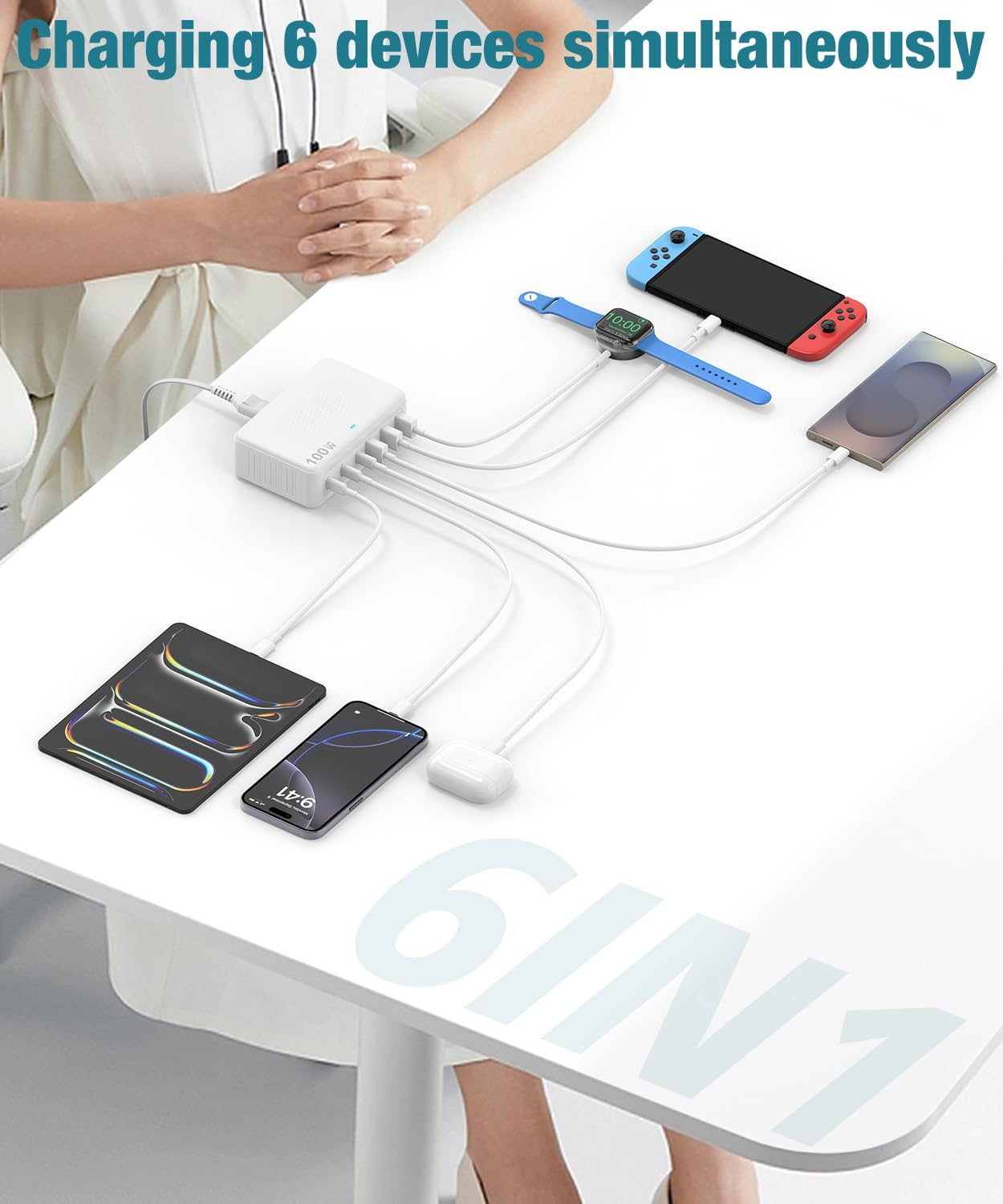 Stacja ładująca z 6 podłączonymi urządzeniami: tablet, telefon, słuchawki, smartwatch, konsola.