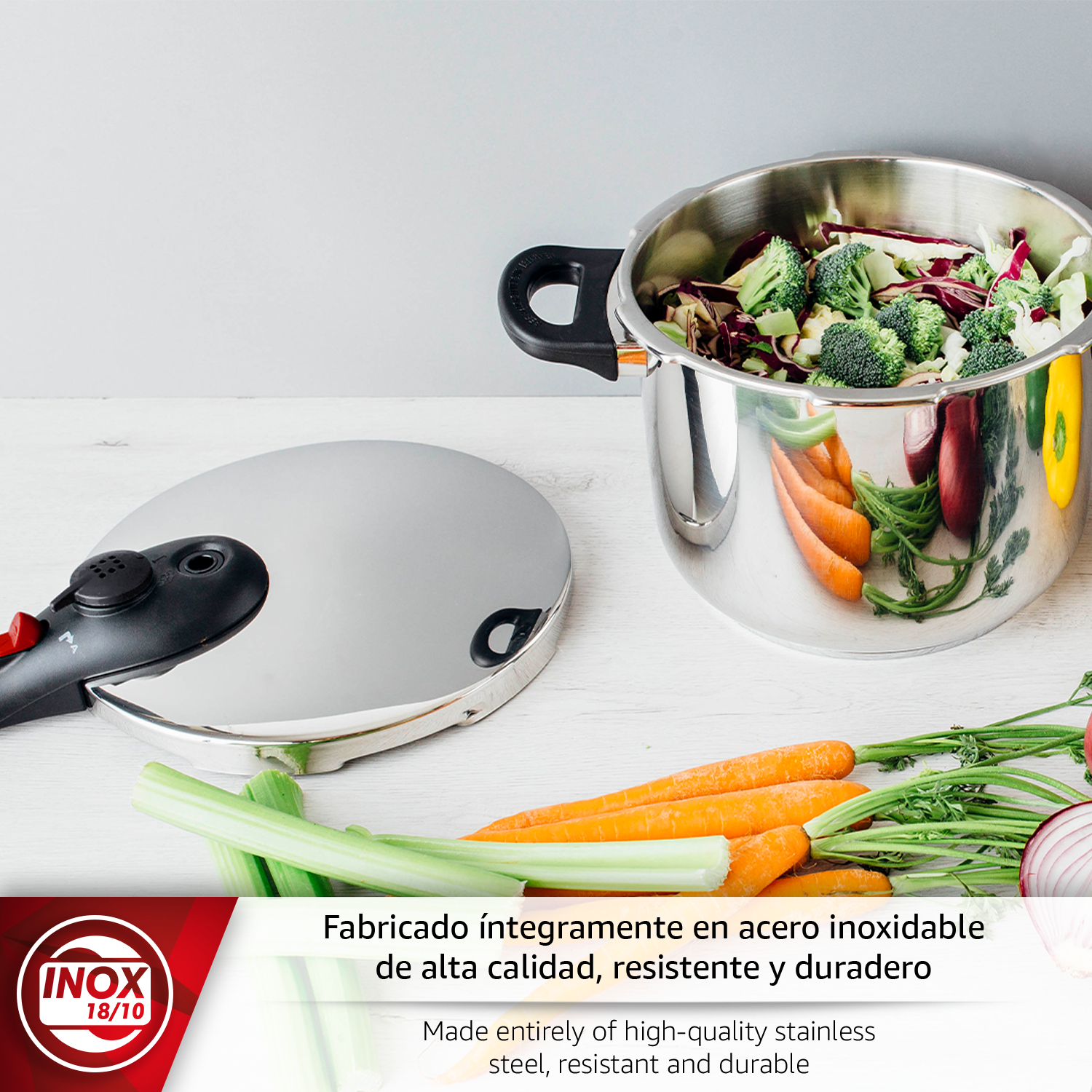 Olla de acero inoxidable con tapa y verduras como zanahorias, brócoli y col morada.